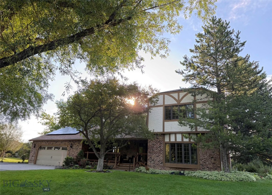Spanning 4,833 square feet, this spacious custom LeClair-built home features 5 bedrooms and 3.5 bathrooms, all set on a beautifully wooded one-acre lot in a highly desirable Southside neighborhood. Surrounded by mature, towering trees, the property offers exceptional privacy, natural shade, and frequent wildlife sightings that create a peaceful, scenic setting. The main level is designed for both everyday living and entertaining, featuring a welcoming sunken family room, a formal dining room, and an inviting living room anchored by a gas fireplace that creates a warm, comfortable gathering space. In the kitchen, a window overlooking the backyard keeps nature in view while you cook or gather with family and friends. Upstairs, the thoughtfully designed layout includes the primary suite, three additional bedrooms, and a conveniently located laundry room. The walk-out basement is spacious and filled with natural light, making it feel like a true extension of the home's living space. Partially finished, it includes an additional bedroom, a dedicated workshop, and a recreation area complete with a pool table—offering flexible space for guests, hobbies, entertaining, or multi-generational living. Outside, the property is just as functional as it is inviting. Dedicated side parking easily accommodates an RV or boat, while a covered utility and pet area, and a designated garden space add everyday convenience. The backyard is designed for enjoying the outdoors, with an approximately 500-square-foot deck overlooking the trees and a hot tub that's perfect for morning coffee, evening meals, or relaxing under the stars as wildlife passes through the yard. Adding to the home's lasting value, 12-inch-thick exterior walls provide exceptional insulation for year-round comfort and energy efficiency, while rooftop solar panels help offset utility costs throughout the seasons.