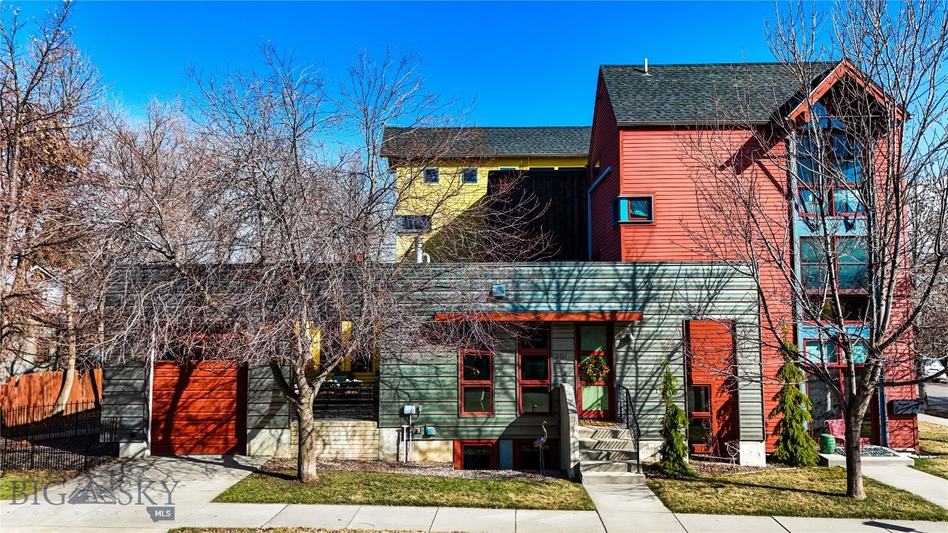 Ideally located in the heart of downtown Bozeman, this architecturally distinctive townhome blends modern design with the convenience of vibrant urban living. Situated on a desirable corner lot in the Black Addition, this south-facing residence offers abundant natural light, thoughtful design, and exceptional access to the very best of Bozeman’s dining, shopping, parks, and cultural scene—all just a few blocks from your front door. 

Spanning approximately 2,300 square feet across multiple levels, the home features three bedrooms and two-and-a-half bathrooms designed to provide both comfort and privacy. The interior showcases clean modern lines and polished concrete flooring, complemented by warm finishes and expansive windows that frame views of the surrounding mountains while filling the home with natural light. 

The thoughtfully designed kitchen flows seamlessly to a private outdoor patio—an inviting space for morning coffee, evening gatherings, or simply enjoying Bozeman’s fresh mountain air. Radiant in-floor heat provides warmth and comfort throughout the colder months, while a mini-split cooling system ensures year-round comfort. 

Outdoor living continues with a private patio and a small fenced side yard ideal for pets or a garden retreat. A rare feature for downtown living, the property includes both a heated attached garage and an additional detached garage, offering exceptional storage and flexibility. 

With mountain views, distinctive architecture, and an unbeatable downtown location near Bell Park and Bozeman’s thriving arts and dining scene, this residence offers a unique opportunity to experience the best of urban Montana living.