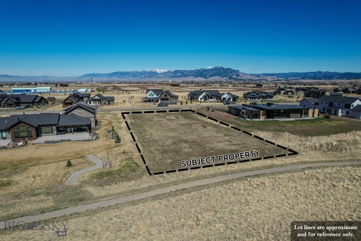 Exceptional 1.07± acre homesite in The Home 40 offering panoramic views in every direction—Bridger Range to the north, Gallatin Valley farmland to the west, the Gallatin Range and Spanish Peaks to the south and southwest, and Mount Ellis to the east - a rare vantage point capturing many of the region’s most iconic landscapes. Offered at $775,000 and including thoughtfully designed architectural plans, this property provides a rare opportunity to build a beautifully designed Montana home in a premier setting. Located just two doors from Home 40’s private clubhouse featuring a gym and pool, and overlooking a serene neighborhood pond, the setting combines natural beauty with luxury amenities. Don't miss an ideal opportunity to build in one of Bozeman’s most desirable communities! ***Buyer responsible for own septic - shown in the included plans. Water is in and has two lines - one potable, and one for irrigation. Electric is already to the lot. 

The images shown are conceptual architectural renderings generated using artificial intelligence and are intended solely to illustrate the potential design and aesthetic of the proposed residence. These visualizations are artistic representations and may not reflect the exact scale, proportions, materials, landscaping, views, or site conditions of the final constructed home.