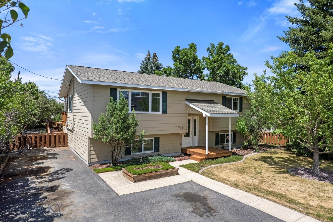 Welcome to 703 Idaho Street, a well-maintained 4-bedroom, 2-bathroom home ideally situated in the heart of Belgrade. With a functional split-level layout, this home offers two bedrooms and one bathroom on each level, providing flexibility for a variety of living arrangements. The main floor features a spacious living room that flows seamlessly into the dining area and kitchen. Step outside onto the refinished back deck overlooking a large backyard filled with mature trees and established landscaping, offering privacy and room to enjoy Montana's seasons. Downstairs, you'll find two additional bedrooms, a full bathroom, a generous family room, along with a dedicated laundry and storage room complete with built-in shelving. Recent improvements add tremendous value and peace of mind, including a brand-new roof installed in May 2026, freshly refinished front and back decks, and a new hot water tank in 2025. Conveniently located with quick access to I-90 and Highway 191, this property places you just minutes from downtown Belgrade, Yellowstone International Airport, and all the amenities, recreation, and employment opportunities throughout the Gallatin Valley. Offering comfortable living, thoughtful updates, and an exceptional location, 703 Idaho Street is ready to welcome its next owner home.