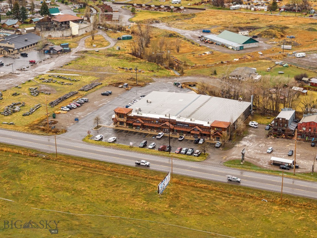 Commercial Income Property with Development Upside
Located less than one mile south of the Four Corners intersection along the west side of US Highway 191, this 33,400-square-foot commercial property offers stabilized income, long-term tenancy, and meaningful upside through future development. The property consists of five condominium units situated on 2.777 acres across two parcels—one improved and one vacant—providing a rare combination of current cash flow and entitled expansion potential in one of Bozeman’s strongest commercial corridors.
The asset features approximately 337 feet of frontage on US-191 South, a high-traffic arterial serving Bozeman and the Gallatin Valley. The surrounding market is characterized by sub-3% commercial vacancy, reinforcing the property’s strong leasing fundamentals and long-term demand.
Property Overview
• Address: 81211 & 81213 Gallatin Road, Bozeman, MT 59718
• Property Type: Commercial — Retail, Showroom & Warehouse
• Total Building Size: 33,400 SF (five condo units)
• Land Area: 2.777 acres (two parcels)
• Frontage: 337 feet on US Highway 191 South
• Occupancy: 100% leased

Development Upside
The second parcel is entitled for an additional 11,518-square-foot building, offering immediate development potential along highly visible US-191 frontage. The site is currently vacant and development-ready, subject to verification of current permits and entitlements.

Cap Rate 7.25% Building & 11,518 SqFt Development parcel.