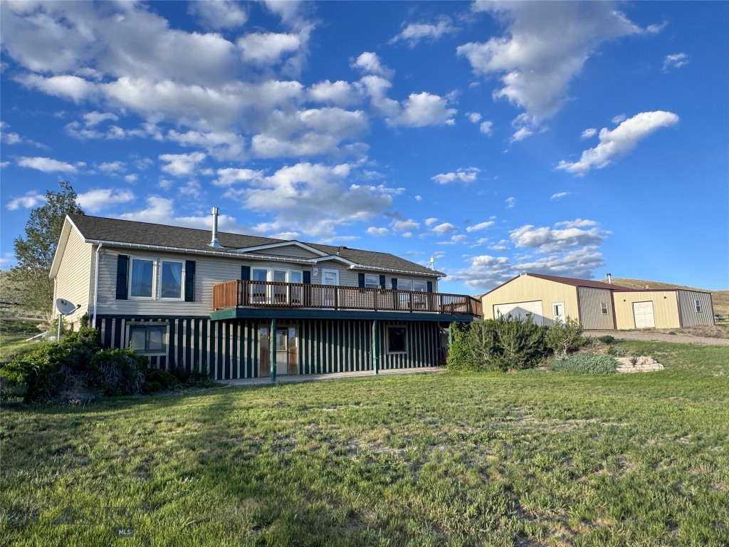 Horse property close to Dillon, MT! Situated on 10.45+/- fenced acres, this 3,136 sqft Montana home offers 3 (almost 4) bedrooms and 2 bathrooms with room to grow. The main level features updated vinyl tile flooring, large windows and a bright living area warmed by a gas stove. The kitchen flows well with plentiful cabinet storage, pantry, gas range and a charming antique cook stove. Direct access from the living room and kitchen leads to the large wrap-around deck to BBQ or simply taking in the mountain and rural views under the big sky! The primary suite includes a large soaking bath, dual sinks, 3/4 shower, closet and sliding glass door to a private porch in the backyard. Two additional bedrooms, a full bath and a dedicated laundry room round out the main level.

Downstairs, the unfinished walkout basement is a blank slate with exceptional potential to expand the living space. Even better? The basement already has a future 4th bedroom sheet-rocked in with a 3rd bathroom and mechanical room framed in, simply waiting for a new owner to finish with their own style. This versatile area could be finished with a home gym, hobby space or entertainment room. Tailor it to fit your lifestyle, enjoy the warmth of the wood stove and enjoy the walk out basement patio area.

Outside, this property is set up for practicality and animals. The 2-car garage is filled with options with 2 separate, attached shop spaces totaling approximately 1,586 sqft. These spaces are perfect for vehicles, equipment, storage or year round projects. An additional lean-to includes a tack area and small chicken coop. 

Additionally, an RO drinking water system was installed in 2025, the septic system was pumped and inspected in 4/2025, has an updated roof and an underground sprinkler system for easy yard maintenance.

Located just minutes from Dillon, this acreage home offers privacy, space and convenience. Whether you’re looking for a horse property, hobby farm, or a home with a shop and room to grow, this property combines practicality and comfort in the heart of SW Montana.