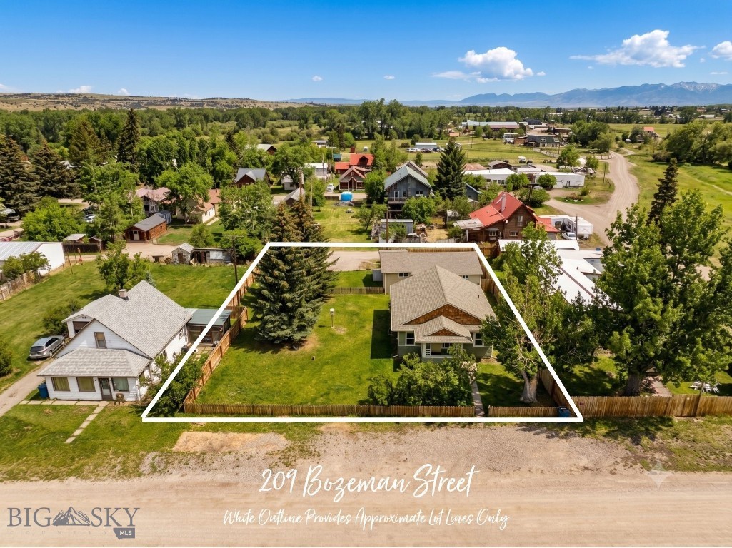 A 1915 bungalow with original hardwood floors, a covered front porch, and over a century of Montana character... paired with a modern guesthouse and a buildable lot, all on 1/3 acre in the heart of Gallatin Gateway. This is the kind of property people move here hoping to find.

The main home (~2,308 sq ft, 3 bed, 2 bath) has been thoughtfully updated while keeping the details that make a historic home worth owning: warm wood trim, period built-ins, and the kind of craftsmanship you simply can't replicate today. The main level features an updated kitchen with white cabinetry, a dining area that flows into the living room, two bedrooms, a full bath, and main-level laundry. The daylight lower level adds a third bedroom, second living area, and a beautifully finished ¾ bath with modern vanities, and it can be accessed from inside the home or through a private exterior stairwell, creating real flexibility for multigenerational living or guest accommodations.

The guesthouse (~1,008 sq ft, 2 bed, 2 bath) is a newer build with a bright, open kitchen, butcher block counters, a covered front patio, and a side yard deck. It's move-in ready as a rental, guest quarters, or home office with complete separation from the main residence.

Both homes sit two blocks from the Gallatin River. Fly fishing, rafting, hiking, and wildlife are part of daily life here, not a weekend trip. Stacey's Old Faithful Bar & Steakhouse and The Westerner (Montana's only real honky-tonk) are a short walk. Bozeman's restaurants, shopping, and airport are 20 minutes north. Big Sky's world-class skiing and mountain biking are 30 minutes south. You're not choosing between access and privacy... you're getting both.

No HOA. No covenants. No known zoning restrictions. The second lot in this double-lot parcel is unbuilt and ready for future development. Whether this becomes your family's home base, a retreat property, or an income-producing investment with short-term and long-term rental potential, the options are wide open.

Properties like this in Gallatin Gateway don't come up often. Call today for a private showing.