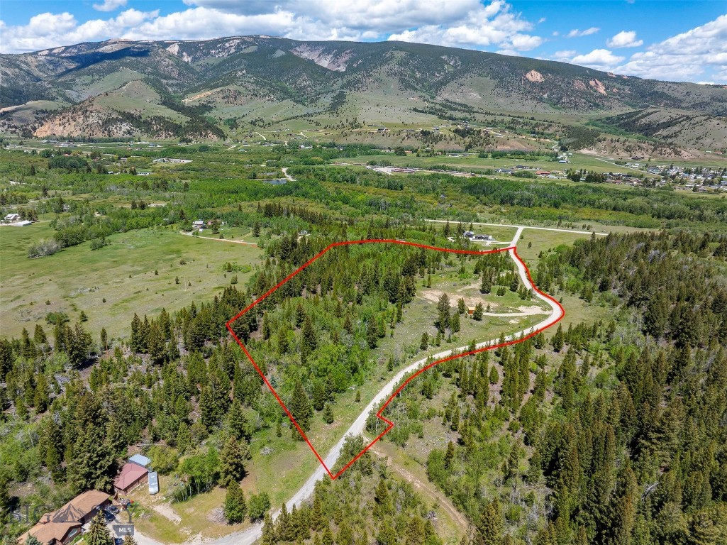 163 Ravndal Road | Anaconda, Montana

Discover your own Montana paradise on nearly 14 acres of pristine land just outside Anaconda. This exceptional property offers the perfect blend of privacy, convenience, and endless outdoor recreation. Surrounded by breathtaking mountain views and featuring a charming year-round creek that meanders through the property, you'll enjoy a peaceful setting with abundant wildlife right outside your door.

Located directly across from the Garrity Wildlife Management Area and only about 300 yards from renowned Warm Springs Creek, this property is a dream for fly-fishing enthusiasts, hunters, and outdoor adventurers alike. Despite its secluded feel, everyday conveniences are just minutes away—only 12 minutes to Anaconda's grocery stores, hospital, and schools, 15 minutes to Georgetown Lake, and 25 minutes to Discovery Ski Area.

The groundwork has already been completed, making this property truly ready for your dream home or cabin. A DEQ-approved septic plan, along with a well, underground power, and a professionally excavated, level building site. A small shed/cabin currently sits on the property, providing immediate utility while you plan and build.

Whether you're seeking a year-round residence, a mountain getaway, or a recreational retreat, this one-of-a-kind property offers the best of Montana living, with the rare addition of a small, flowing creek that adds beauty, tranquility, and the soothing sound of running water throughout the seasons.

Build your dream cabin, mountain retreat, or forever home and experience Montana living at its finest!