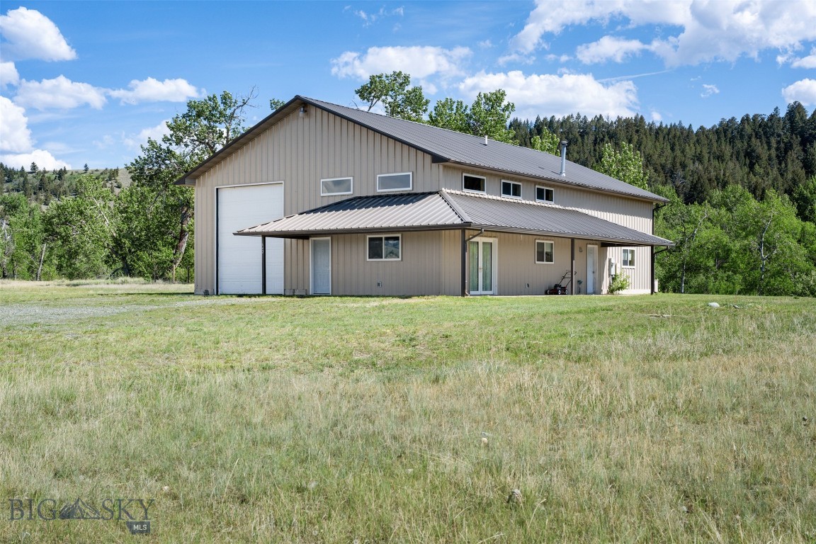 Discover your own slice of paradise with this stunning 17.02-acre property, perfectly blending comfort and practicality. Situated just 2.6 miles from town, this unique estate features a spacious 2400 square foot building that includes a nicely designed one-bedroom, one-bath living quarters. Step inside and find an open-concept kitchen and living area, ideal for entertaining or enjoying quiet evenings at home. The loft adds an extra touch of charm for a sleeping area or office, while the bathroom conveniently includes a laundry area with direct access to the shop. Experience a year-round comfort with in-floor radiant heating throughout the building. The living area includes French doors that lead to a covered patio area, where you can soak in the mountain and valley views. For the hobbyist or entrepreneur, the expansive 1800 square foot shop area features an RV garage door and a 50-amp service, making it easy to accommodate your recreational vehicles. The property also includes two productive wells and Cottonwood Creek frontage, perfect for enjoying nature or potential pasture space for animals. Embrace the tranquility of country living while still being close to town. This property offers endless possibilities for relaxation, recreation, and investment. Don't miss the chance to make this dream property your own!