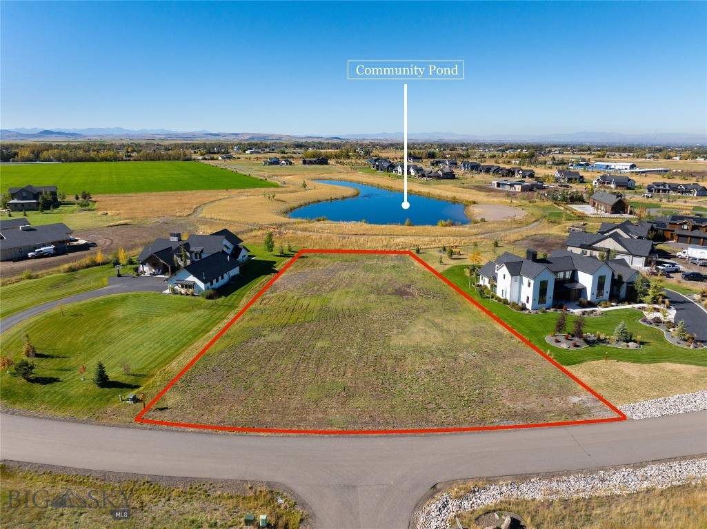 The 1.11-acre flat lot is located within the esteemed amenitized community of Home 40 in Bozeman, Montana. Bozeman is a picturesque city known for its natural beauty & outdoor recreational opportunities. The Home 40 community is renowned for its upscale features, homes & exclusive amenities. Situated on this expansive lot that backs to the community pond, you will find a level topography that provides ease of construction & ample space for various possibilities. The flat terrain offers a convenient building site, allowing you to design & construct your
dream home with ease. One of the key attractions of this lot is its breathtaking views of the Bridger Mountains & Spanish Peaks. The Bridger Mountains, known for their rugged beauty & majestic peaks, offer a stunning backdrop to your future residence. The Spanish Peaks, with their distinctive silhouette, add another layer of natural beauty to the panoramic vistas visible from this lot. Being part of the Home 40 community, you can expect a range of prestigious amenities and services including ponds, a swimming pool, and clubhouse with exercise room. This community is designed to provide an exceptional living experience, combining luxurious living with the charm of the surrounding natural landscape. Some of the amenities you can enjoy include well-maintained common areas, walking trails, recreational facilities, and access to community gatherings. Living in Bozeman, Montana offers a myriad of opportunities for outdoor enthusiasts. The area is renowned for its world-class skiing, hiking, fishing, and other recreational activities. Additionally, the city itself boasts a vibrant downtown area with charming shops, restaurants, and cultural attractions. In summary, this 1.11-acre flat lot within the Home 40 community in Bozeman, Montana, presents an incredible opportunity to build your dream home. With its stunning views of the Bridger Mountains and Spanish Peaks, as well as access to the luxurious amenities of the community, this lot combines the best of nature and upscale living.