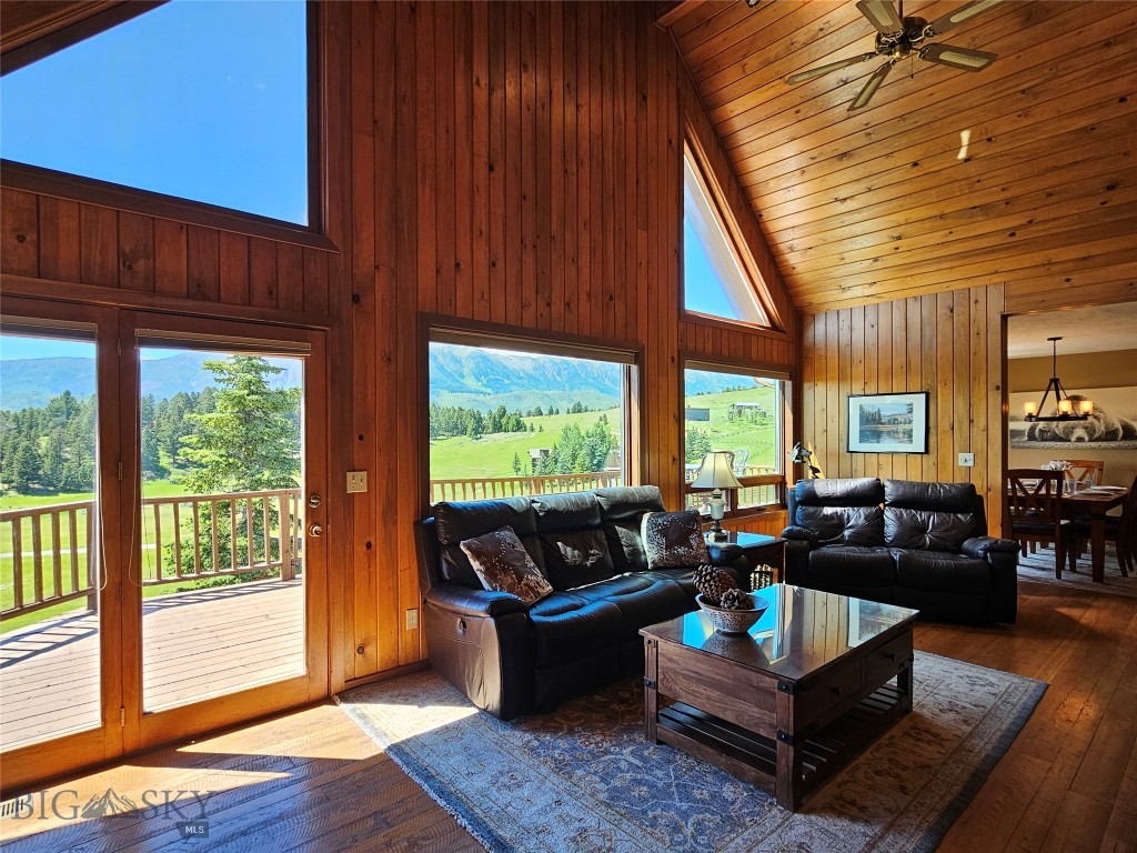 Perched on an elevated 10-acre homesite in the heart of Bridger Canyon, this exceptional property provides panoramic views of two mountain ranges – the nearby majestic Bridger Range and the dramatic Spanish Peaks stretching across the distant horizon. This setting embodies the very essence of “Big Sky” Country - expansive, peaceful, and unforgettable.

With room to roam in every direction, the property showcases a front-row seat to spectacular sunsets, snow-capped mountains, wildlife, and Montana’s ever-changing seasons.  The deck extends the living space outdoors, providing an inviting setting for dining and entertaining against a backdrop of wandering elk, deer, and soaring raptors. The hot tub offers the perfect place to relax and unwind beneath Montana's expansive skies after a day on the nearby trails or slopes.  

The interior is equally impressive.  A dramatic two-story stone fireplace anchors the great room, while a two-story wall of windows frames the breathtaking beauty of Bridger Canyon, filling the home with natural light and blurring the line between indoors and the surrounding landscape. Exposed timber beams, a vaulted ceiling, and custom wood flooring add warmth, character, and timeless mountain elegance.

Designed for both everyday living and entertaining, the home features four thoughtfully positioned bedrooms on two levels, a versatile loft ideal for a reading retreat, home office, or additional sleeping area, a walk-out lower level with a multipurpose room, additional utility room with abundant storage, and a separate bonus room for a private office, fitness room, hobby space, or studio.

Completing the property is a substantial 1,300+ square-foot outbuilding providing for vehicles, recreational equipment, horses, a workshop, or memorable gatherings. 

Every drive to and from the property is part of the experience, following the scenic beauty of Bridger Canyon through one of Gallatin Valley’s most sought-after landscapes. Downtown Bozeman is only 11 scenic miles away, with fine dining, shopping, cultural events, and everyday conveniences. Bridger Bowl's legendary "cold smoke" powder skiing is just 10 minutes from your door. 

Seldom does a property combine this level of privacy, acreage, views, and convenience in one of Bridger Canyon's most desirable locations. More than a home, this is a place to experience Montana in its truest form. 
Views – Privacy – Possibility. This is Bridger Canyon at its finest.