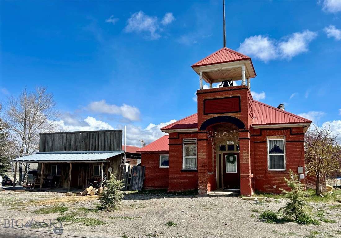 Historic Montana property with land, utilities and endless potential. No Covenants + mountain access=rare opportunity to create your own vision. Set on 1.95 aces and just 30 minutes from Dillon, this historic building is a true piece of local history. Originally built by the community in 1903 as a schoolhouse, it reflects a character that simply can't be replicated today. Located in the heart of prime hunting and fishing country with immediate mountain access, this property is perfectly positioned for outdoor enthusiasts and those seeking a one of a kind Montana retreat. From schoolhouse to cafe, this unique building has served the community for over 120 years. Recently, converted for residential use, the structure offers approximately 1500 sq ft of flexible space ready for your vision. This property is being sold "AS IS" simply due to its age. The property is already equipped with essentials: private well, two septic tanks and established utilities providing a solid foundation for renovation or continued use. Outside you'll find a livestock lean to and chicken coop along with plenty of space for horses, gear, trailers, RV's, and/or expansion. With no covenants, you have the, freedom to create your ideal set-up whether its a hunting cabin, recreational basecamp, or homestead. Adding to the charm and authenticity, the original historic school house piano, chalkboard, bookshelves and school bell will convey with the property. 

Don't miss out on this unique opportunity!