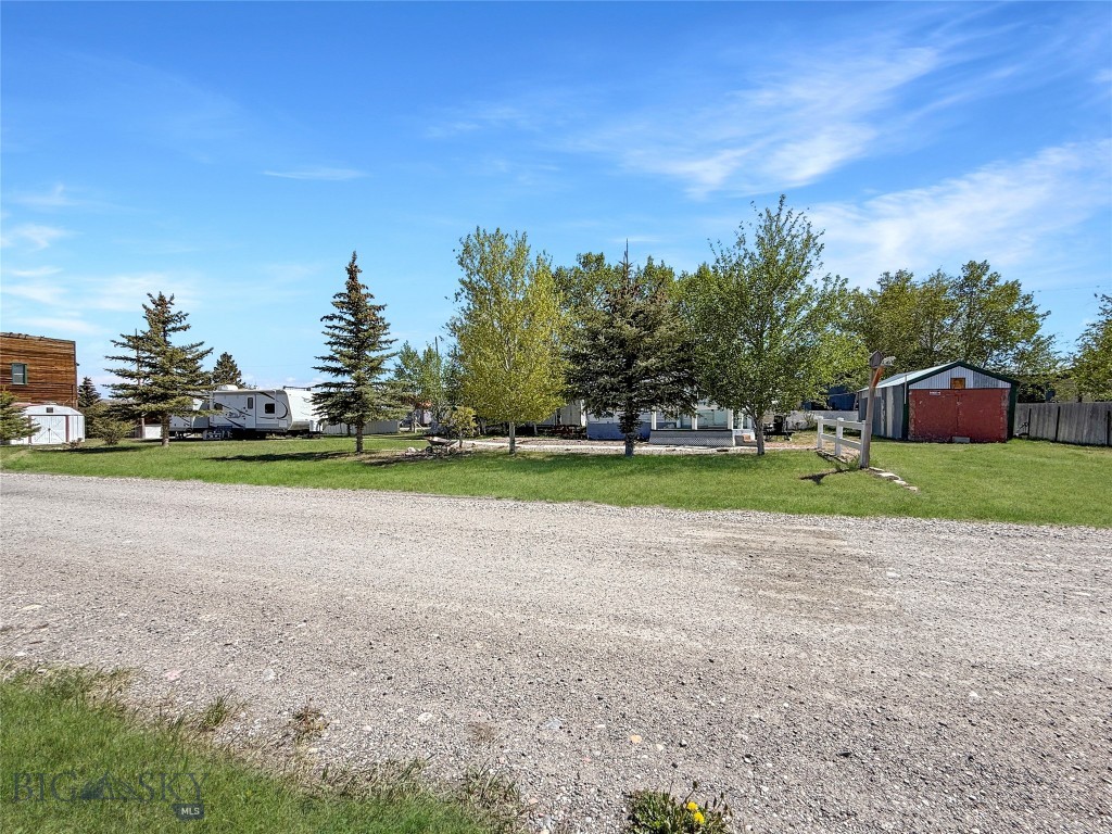 Lot located in the heart of recreational paradise with a view of Lima Peaks from the front deck! Property is conveniently located on the edge of town close to Lima's park. There is a completely enclosed car port currently being used as a garage/shop. A metal storage shed big enough for lawn mowers and tools as well as a 3 sided shed that the current owners use as a little sitting nook. The property is serviced by city water with its own sewer and currently has two campers that are included with the property. There is a 32' 2015 Jayco that the current owners have set-up for use by their guests, and a 26' 2005 Thor that they have used to stay in for years when they would come up in the summer! Campers have clean clear title and will transfer at time of sale! Don't miss this opportunity to own a little place!