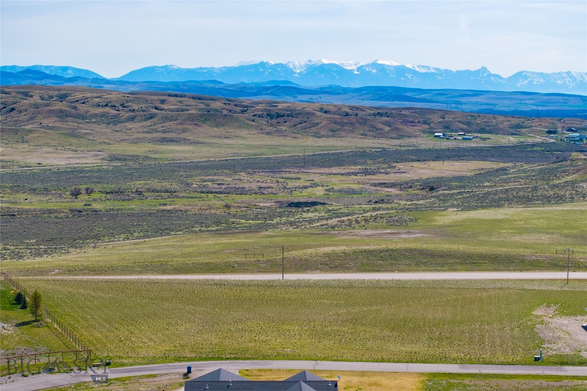 Welcome to Wheatland Meadows, a peaceful community nestled in the scenic rolling hills just off Highway 287. This level 2.16-acre parcel is ideally positioned near the front of the subdivision, offering a sense of privacy with elevated views that shield it from direct road visibility. Enjoy expansive mountain views from this quiet loop, where the generous lot size enhances the spacious, open feel. Power is already available at the lot line, and the neighborhood features paved roads, well-maintained parks, and flexible covenants—including the option to build a shop—perfect for storing all your tools, toys, and outdoor gear. With quick access to I-90, Bozeman is just a short drive away. Don’t miss your chance to build your dream home in this ideal Montana setting!