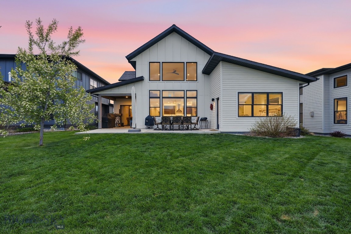 Park-side living in The Crossing, with trails out back, acres of open space behind the lot, and Gallatin Regional Park across the street. This thoughtfully designed home was built by Old Mill Homes and offers approximately 2,822 sq ft, 4 bedrooms, 3 full baths, a 3-car garage, and a layout that lives beautifully with vaulted ceilings, extra windows, and an easy open flow between the kitchen, dining, and living spaces.

The kitchen anchors the home with quartz countertops, a gas range, abundant cabinetry, under and over cabinet lighting, and a generous walk-in pantry with built-ins. Designed for both everyday function and elevated living, the main level flows naturally to the patio and open space beyond.

The main-level primary suite is positioned for privacy and a strong connection to the outdoors, with direct patio access for seamless indoor-outdoor living. The ensuite bath features a floor-to-ceiling tile shower, a large soaker tub, a dual vanity, and an oversized walk-in closet.

Upstairs, you’ll find two additional bedrooms, a full bath, and a spacious loft that works beautifully as a second living area, office, or media space, finished with a striking custom metal railing.

The yard is a true advantage, offering lower-maintenance living without sacrificing the feeling of space, thanks to the open acreage directly behind the property and the trail system just beyond. With central A/C, excellent storage, a 3-car garage, and one of Bozeman’s most convenient park-adjacent locations, this home delivers the rare combination of comfort, function, and everyday access to trails, parks, and open space.