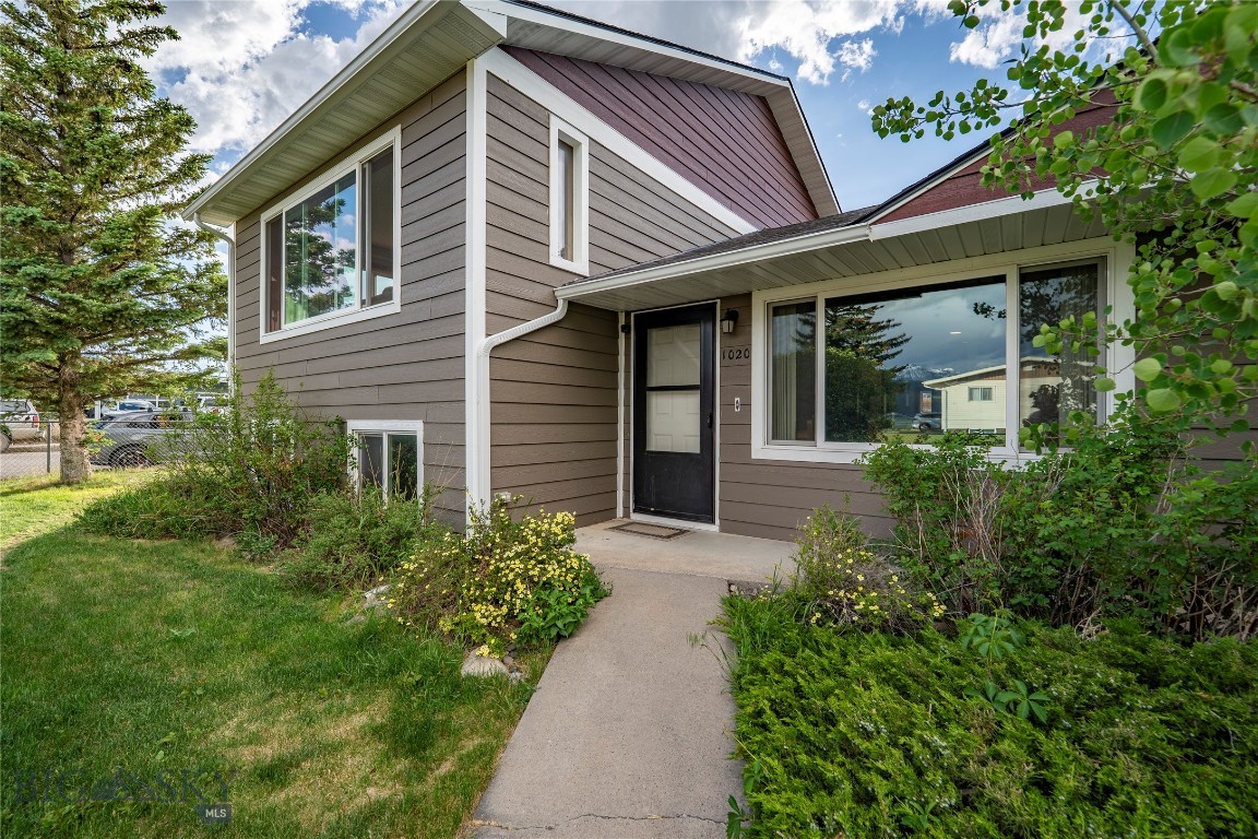 Are you looking for an in-town home with a heated RV garage? How about a home with an RV garage and an additional heated two-car garage? - And what if that home was a beautifully-updated mid-century split-level home boasting five bedrooms and three bathrooms on a roomy corner lot, complete with hardwood flooring and central refrigerated air conditioning? Have we piqued your interest? Now let’s add the good stuff - new windows, new siding, an almost new 50-year roof - and unobstructed braggin' rights views from oversized picture windows! The primary suite is on the upper level and is serviced by a beautifully-updated bathroom outfitted with ceramic tile and a glass-enclosed step-in shower. Three more bedrooms and a full bathroom are located on the main level - and there is a guest bedroom / office and another three-quarter bathroom on the basement level! - And the basement offers built-ins and plenty of storage! There is a main level living room, complete with a toasty wood stove - and a lower level family room! In addition, there is a cellar under the laundry room - and the laundry boasts plenty of storage and an oversized farmhouse-style laundry sink! Step outside and you’ll find lush green landscaping watered by underground sprinklers and interspersed with multiple inviting patio areas - and all this is just minutes from downtown Livingston! - And did we mention the RV garage? Schedule your showing today!