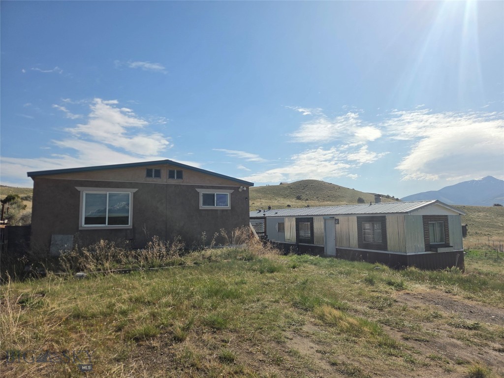 These Two manufactured homes on 6.42 acres provide an excellent opportunity in the heart of Paradise Valley. Whether you're looking for a property to owner occupy, an income-producing investment, or future redevelopment opportunity, this versatile property is well-suited to a variety of strategies. Situated on 6.42 acres with outstanding mountain views, this property features two manufactured homes and exceptional access to outdoor recreation, including nearby Yellowstone River, National Forest lands, and Yellowstone National Park.
Adjacent parcels are also available for purchase, creating the potential to assemble up to 20 total acres. One home is currently generating $1,000 per month in rental income, while the second offers additional rental potential or could serve as an owner-occupied residence.  Both homes are 3 beds, 2 baths.  One is 1450 +/- SF, and the second is 980 +/- SF with an attached garage. Homes are sold As-Is.  Properties don't come along in Paradise Valley at this price point very often.  Call Today!