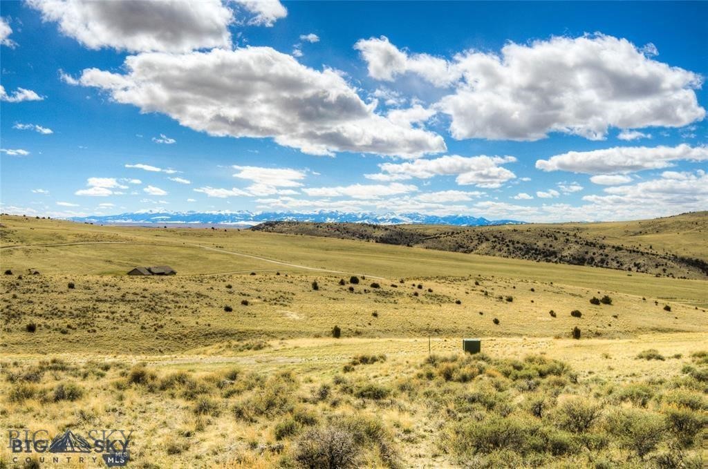 Pick your perfect homesite on this scenic 20-acre parcel where power is conveniently available at two different corners. With no common area restrictions, you have the freedom to build where you choose-surrounded by the mountain views you love most. Enjoy the best of both worlds: privacy and space while still being part of a welcoming community only 25 minutes from Bozeman. From your deck, you’ll see nature—not neighbors. Covenants allow for a home, guest home, shop and barn making this property as versatile as it is beautiful. The neighborhood offers 2.5 miles of private Gallatin River access, along with a walk-out river picnic area complete with a gazebo, BBQs, and a firepit. You’ll also enjoy miles of hiking and horse-riding trails, access to 640 acres of State Land, and the chance to watch wildlife right outside your door. Only 3 minutes to State Land. Some photos represent the Ranch as a whole or area amenities. Located in quaint Manhattan which means you are just 15 minutes from the airport and 25 minutes to downtown Bozeman’s dining, shopping, and entertainment. Located in desirable Manhattan School Dist. Welcome to Big Sky Country—where your Montana dream begins.