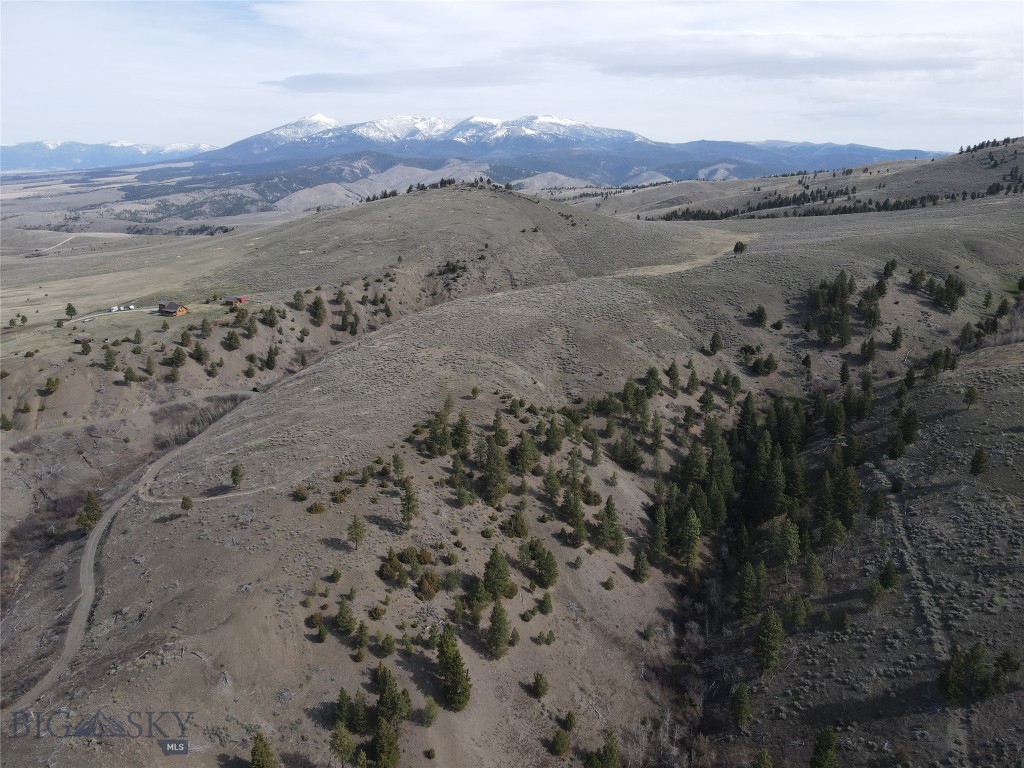 Escape to your own slice of Montana with this beautiful 12+ acre with wide open space, rolling hills, and beautiful mountain views.  The property features a seasonal spring that adds to the character of the land and attracts the wildlife that have visited the parcel including- elk, deer, wild turkey and black bear.  Located just a short drive from Helena National Forest, Canyon Ferry Lake, and the Elkhorn Mountains and state land nearby you'll have access to fishing, hiking, and year-round recreation.  A driveway has already been started, making access easier and giving you a solid start whether you're planning to build, camp, or just enjoy the property as it is.  Plenty of space to create your own setup while still feeling private and tucked away.