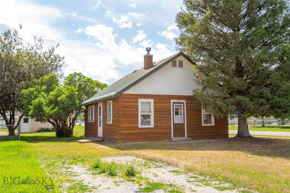 Original log cabin on a large corner lot with city water and sewer. This 1-bedroom, 1-bath home has been impeccably maintained and features some original wood flooring that adds to its character and charm. Conveniently located within walking distance of schools and downtown Townsend, you’ll enjoy easy access to local amenities while still having plenty of space on a large corner lot. A rare opportunity to own a well-kept log home in town.