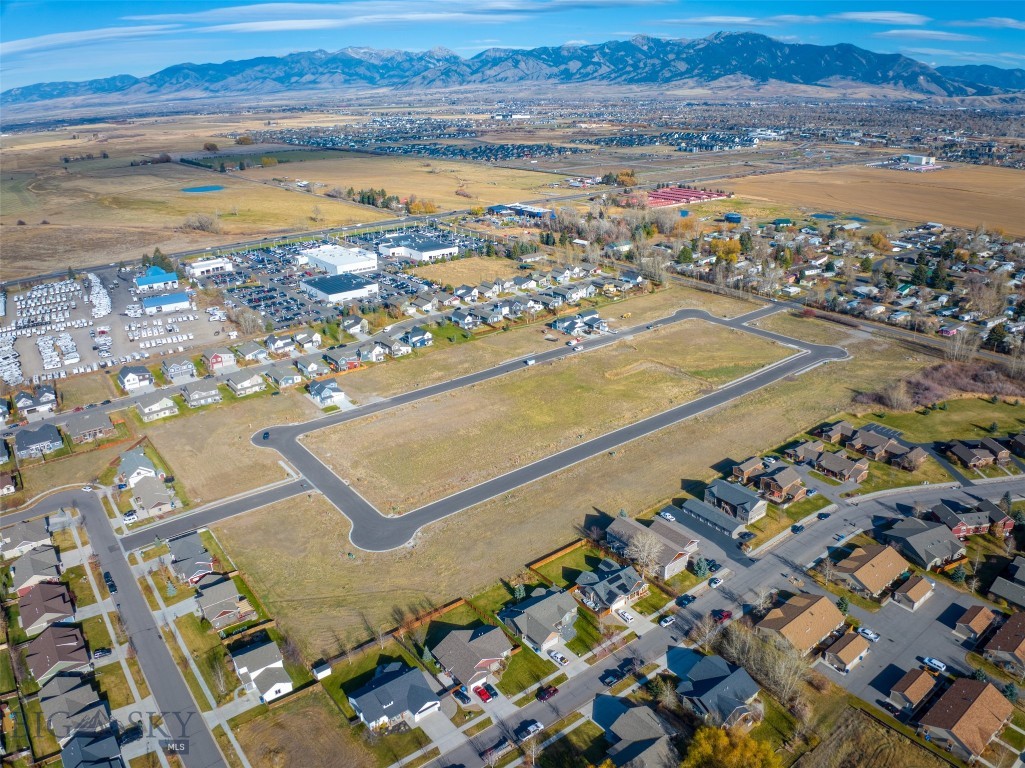 New single-family subdivision lots ready to build. Woodbury Grove Subdivision combines the beauty of Montana's rural landscape with the convenience of living just minutes from everything Bozeman has to offer. This subdivision offers wide streets and sidewalks creating a neighborhood feel rarely found outside Bozeman city limits. A Master Plan designed to create multiple living options from single family homes to townhouse lots and a few condo units will create an intimate community for every home as the development grows. Traditional architecture, responsible design, quiet streets, and more make Woodbury Grove perfect for families with children to build a community together over time. Located on the west side of Bozeman, 10 minutes from downtown or to the Gallatin River.