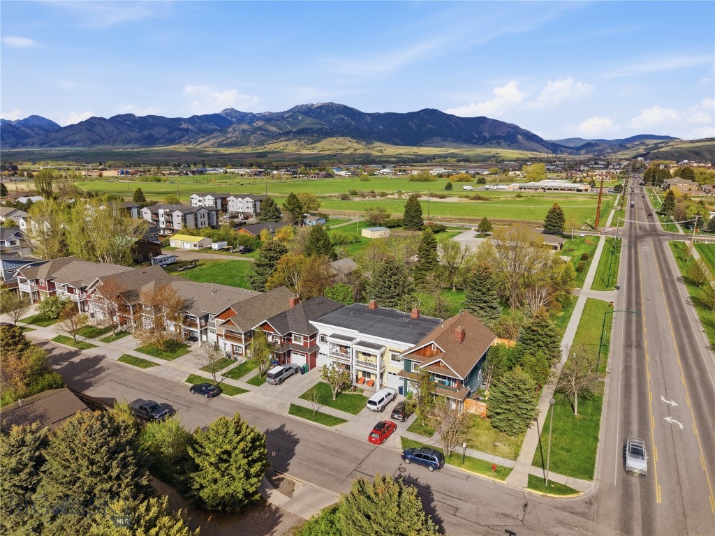Welcome to 2120 Buckrake Avenue, a well-positioned Baxter Square townhome offering 1,724 square feet, 3 bedrooms, 2.5 baths, and an oversized attached garage in a convenient Bozeman location.

The main level features hardwood floors, a comfortable living room with a gas fireplace, a generously sized kitchen, dedicated dining area, half bath, and direct garage access. Upstairs, all three bedrooms, two full baths, laundry, and a bonus family room create a flexible layout that lives larger than expected, a rare little miracle in townhome land.

The primary suite includes a spacious bedroom, walk-in closet, and private bath. Outside, enjoy a fenced backyard, covered porch, covered deck, patio, underground sprinklers, and mature landscaping that adds privacy and an established feel.

Please note backyard garden boxes are excluded from sale!

Set near parks, sidewalks, and trail systems, this location also offers convenient access to Bozeman breweries, Target, WinCo, coffee shops, and everyday west-side amenities.