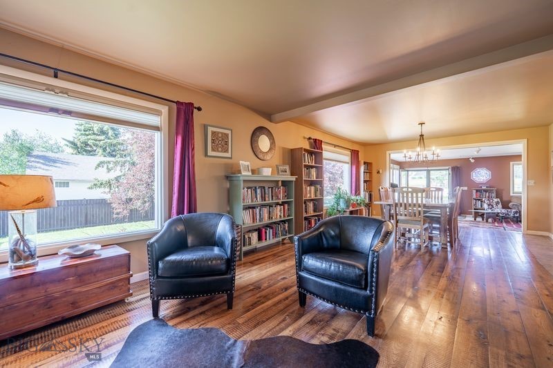 This beautifully upgraded 4 bedroom, 2 full bath home is oozing with character. It boasts original built in dressers and walk-in attic access in all of the upstairs bedrooms and the most charming stairwell you ever did see!  As you enter the home, the hickory floors will blow you away as the space is flooded with natural light from the oversized windows. The pellet stove and heated tile in the kitchen will keep you cozy in those Montana winter months. The fully fenced yard is private and perfect for relaxing. Mature trees and professional landscape add shade and the feeling of whimsy. The back deck has recently been stained and is wired for your new hot tub. Underground sprinklers and a drip system make caring for the large yard a breeze. The carport already has hanging boat storage and the property already has RV hook-ups as well. There is a 10'x16' shed in the back yard with a loft, work bench, and electricity! Gorgeous Montana mountain views abound. The Shields river is just minutes away. Located next to schools and the park in the cutest little town of Wilsall.  Come see what makes this property so special!