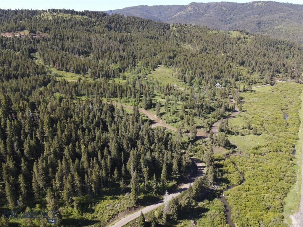 Introducing one of the best last places and you have the opportunity to call it home!! This 129.49 +/- acre parcel waits the sophisticated buyer who is looking for the ideal purchase of a large tract of unencumbered land – no HOA’s, no CCR’s, and 15 minutes from downtown Bozeman. It includes a 1,700 sq ft one bedroom/one bath carriage house ready for occupation. A 3200 sq ft barn with two horse stalls, two separate fenced horse corrals and multiple riding trails exist onsite. All the infrastructure is developed: electrical power to all structures including the building pad; three wells drilled, two are in operation; two septic fields permitted/installed, one is in operation; all driveways/interior roads developed and maintained. The only thing left to do is to get your dream under construction. There are multiple water features including a ¼ mile of Rocky Creek frontage, several natural ponds, a small lake, and multiple creeks/streams/natural springs. Being a natural sanctuary for a diverse population of wildlife – moose, elk, deer, bear, sandhill cranes, songbirds, and waterfowl to name a few and this is due to the fact that this property exists within the Greater Yellowstone Ecosystem. There is nowhere in the world as unique as the Greater Yellowstone Ecosystem with its vast mountain ranges, the largest concentration of wildlife in the lower 48 states, its scenic beauty and Bozeman’s ever- growing economic value. It’s all waiting for that right buyer who is independent, knows economic value, seeks privacy, serenity, and has respect for the bounty that mother nature has provided. Listed at $4,995,000 with conveyance of remaining gas, oil and mineral rights (that’s less than $39K per acre with structures). Call today for your exclusive showing of this best last place.