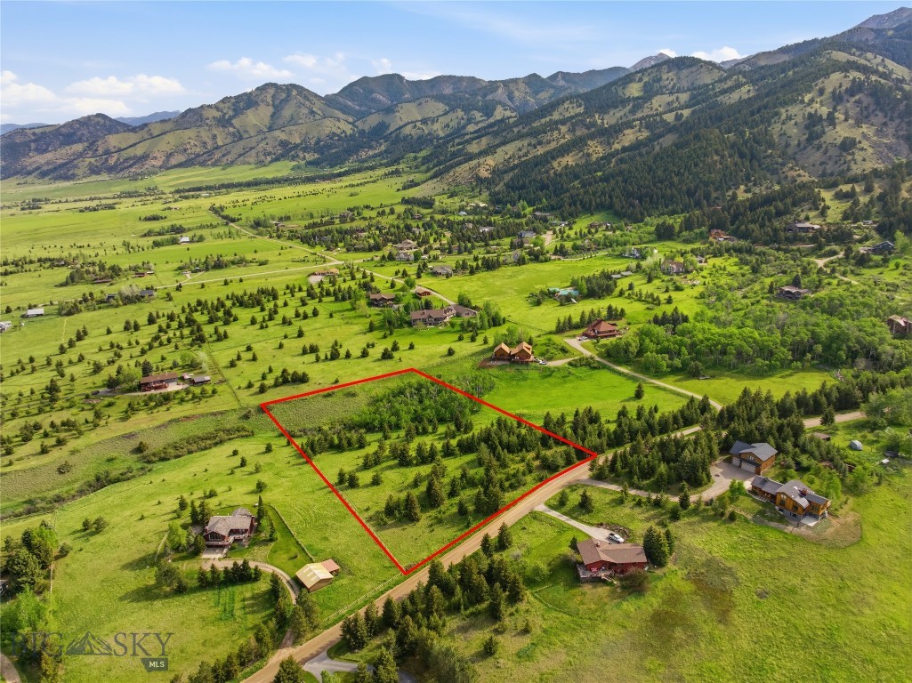 Nestled in the heart of Montana’s breathtaking landscape, this exceptional 3.71 acre lot in Grandview Heights offers the rare combination of privacy, natural beauty, and spectacular mountain views. Located just 10 minutes from the vibrant community of Bozeman, the drive to/from town showcases the surrounding mountain ranges and entire Gallatin Valley.

With mature trees and open skies, this peaceful property captures the essence of Big Sky Country. Whether you’re enjoying watching wildlife, a sunset painting the sky with an abundance of color or the alpenglow settle across the Bridger mountains, you are bound to feel a heightened connection to nature.

Experience the majestic scenery in every season—from snowcapped winter peaks to wildflower filled summers to golden autumn colors in your Aspen grove. The desirable building sites can maximize both privacy and views, creating endless opportunities for a custom design and outdoor living spaces.

Despite its peaceful setting, the property remains conveniently close to all the amenities making Bozeman one of the West’s most sought-after destinations. World-class skiing, blue-ribbon fly fishing, hiking, biking, and endless outdoor recreation are all within easy reach. Downtown Bozeman offers a thriving mix of fine dining, local boutiques, art galleries, community events and Montana State University. And an added bonus, Yellowstone National Park is just a scenic drive away.

If you’ve been searching for a place where you can experience Montana’s unmatched beauty, bring your vision to this  stunning 3-acre property, take a deep breath of mountain air and imagine the possibilities.