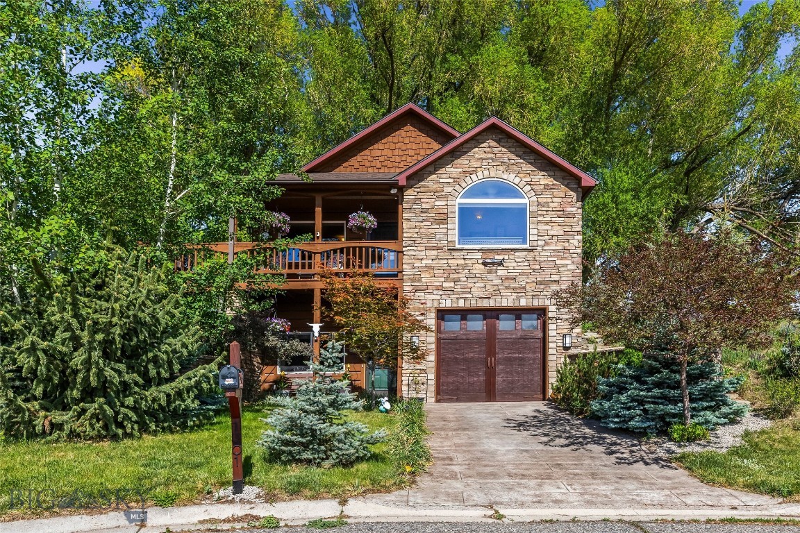 This beautifully crafted 3-bedroom, 2-bath home built in 2006, offers 1,896 sq. ft. of living space on an expansive 12,782 sq. ft. lot at the end of a cul-de-sac.  Inside, you’ll find many recent updates, including fresh interior paint throughout, new luxury vinyl kitchen flooring, new carpeting on the stairs, upgraded lighting, and new smoke detectors. Both bathrooms feature new fixtures, and the downstairs tub has been beautifully refinished. The striking chimney surround has been upgraded with Evolve Stone and topped with a custom raw copper chimney cap, adding timeless curb appeal. Additional improvements include a wood plank stamped driveway and an air conditioning system (2022).  A $3,000 carpet allowance for the downstairs gives buyers the opportunity to add their own finishing touch. The exterior siding and beams, which were milled and cut directly on the property, combined with the natural stone veneer give this home a distinctive character. Backing up to ranch land, this property offers a sense of privacy and open space with beautiful views of Livingston Peak, the Absaroka Mountain Range, and Sheep Mountain. A seasonal irrigation ditch runs along the back property line, creating a soothing backdrop of trickling water. Mature landscaping surrounds the home adding shade and privacy, while the attached garage adds everyday convenience. Located just a few blocks from the new Livingston Wellness Center (scheduled to open in 2027), this property combines comfort, craftsmanship, scenery, and location in one exceptional package.