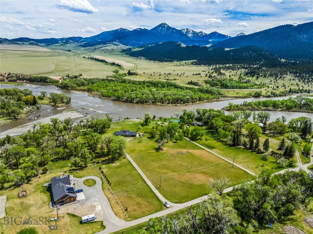 Yellowstone River Retreat is an extraordinary offering situated on over 6 acres just minutes from downtown Livingston that combines direct frontage on the legendary Yellowstone River, iconic mountain views, investment income & future development potential. 

The property includes 2 separate lots. Lot 3A includes 4.186+/- acres & features a 2,130 sq. ft. 2-story home with 4 bdrms, 3 baths & an attached 2-car garage. The home underwent an extensive interior renovation in 2023 & is being offered turnkey & fully furnished. Currently operating as a highly successful short-term vacation rental accommodating up to 8 guests, the property has earned more than 60 five-star reviews & has established itself as a profitable investment property. Additional opportunity exists to expand the property’s rental potential as the upstairs has remained locked & reserved as private owner’s quarters. A future owner may choose to incorporate the upstairs into the rental space increasing the sleeping capacity to 12 +/- guests & creating an even stronger income. Income records are available upon request.

Lot 4A includes 2.248+/- acres & offers a flat, buildable homesite with incredible views of Livingston Peak.  This lot is located outside the floodplain and has DEQ approval for well & septic, creating a unique opportunity for a future residence, guest home, or long-term investment.

Located on the Yellowstone River, the property offers direct access for world-class fly fishing, floating & of course the river encourages a robust wildlife habitat for viewing in one of Montana’s most treasured settings. Much of the property remains outside the 100-year floodplain & the home did not flood in 2022. Outdoor living is enhanced by a large deck, sweeping mountain views & peaceful gathering areas.

Inside, the home reflects a warm Montana Style with comfortable gathering spaces, inviting finishes & a layout well suited for entertaining, relaxing or hosting guests. Whether used as a primary residence, second home, vacation rental or legacy investment, this property offers a rare combination of lifestyle, income, land, fishable water & exceptional location.

Only one ownership transfer has occurred in the last 57 years underscoring just how rare it is that a property like this becomes available. Approximately 27 minutes from Bozeman & about 50 minutes from the entrance to Yellowstone National Park, this is a truly exceptional opportunity.
