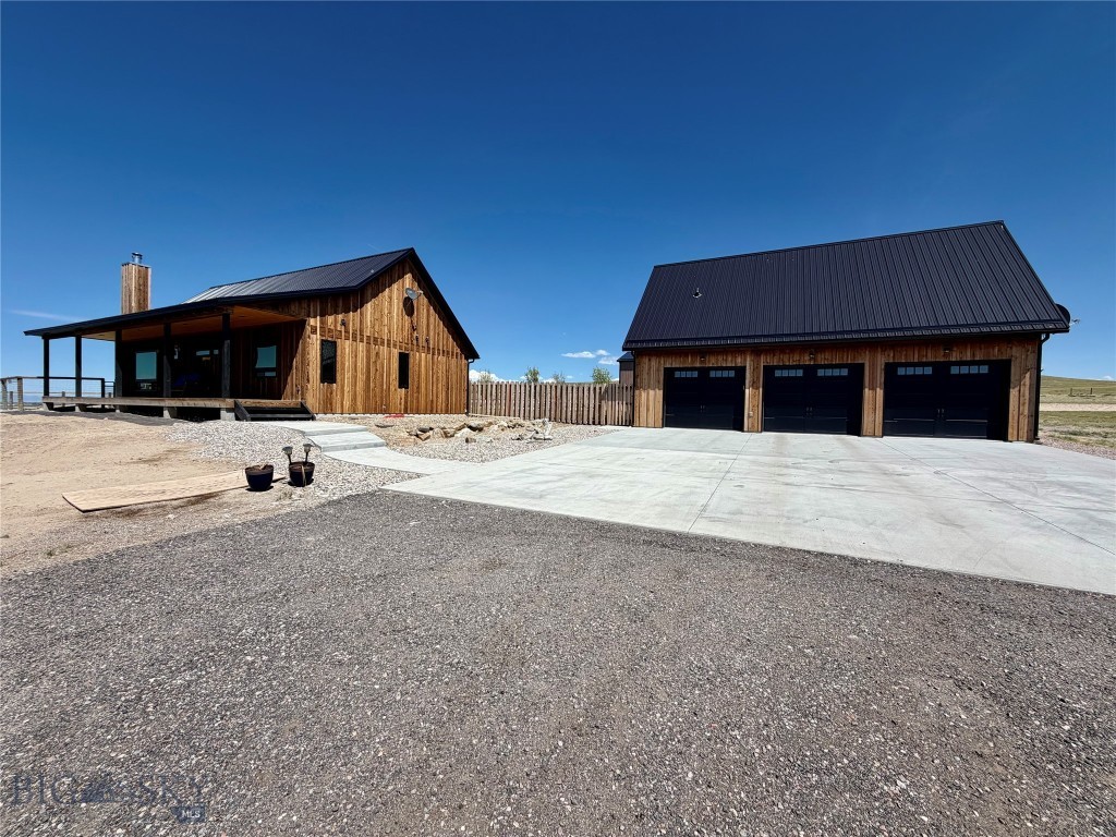 Experience the beauty of Montana living in this custom built 2,688+/- sf home with unrivaled mountain and valley views. Constructed in 2020 and situated 9.53 acres, this property offers incredible views and modern durability. The tranquility of the location is unmatched, you have total peace and quiet. Enjoy the comfort of the open concept living w/vaulted ceilings in the living, dining and kitchen area…..great for entertaining and hosting family gatherings. This home is thoughtfully designed with large windows in every room, cozy living room with Quadra Fire wood insert stove, an exceptional kitchen featuring stainless steel appliances, quartz countertops w/bar seating, ample counter space and custom alder cabinetry and a very functional laundry room. Comfortable primary suite on main floor with large bathroom, dual vanity, walk-in tiled shower and large walk-in closet.  The basement features a large family room with pool table, lockable office, 2 guest rooms and a full guest bath. Home is heated & cooled with a geothermal system and also comes with a water softener. Enjoy the covered front porch rain or shine….it’s perfect for relaxing with a cup of coffee in the morning or in the evening to watch a thunderstorm move through the valley.  Well maintained and landscaped yard with underground sprinklers and fenced back yard for your furry friends. This property also offers a detached 3 car garage with an 1,120+/- sf fully furnished 1 bedroom, 1 bath guest house and a newly constructed 30’ x 40’ heated shop with two 14’ x 12’ overhead doors on either end for easy drive through.….ideal for those needing extra pace for toys, storage or projects. RV parking pad with electricity and septic dump. This is a must see property and is being sold fully furnished…..with 9.5+ acres there is room for animals.  Country living yet close to town. Call today to schedule your private showing.