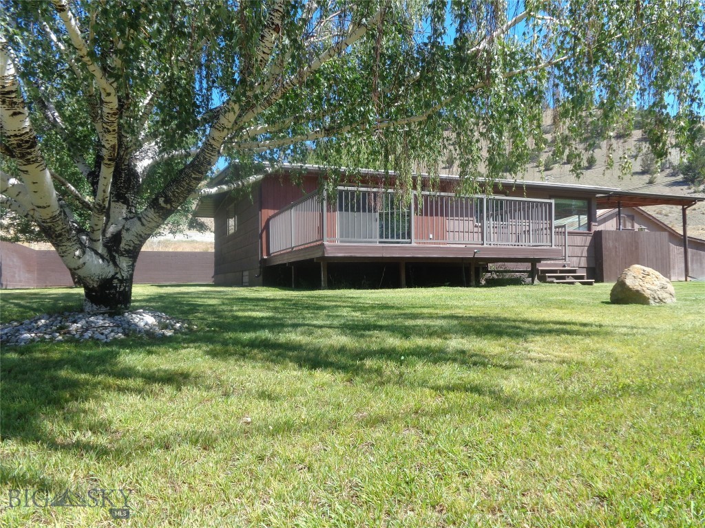Well-maintained property on nearly one acre adjacent to and overlooking Warm Springs Creek & Washoe Park.  The residence has three bedrooms and two bathrooms and 2280 square feet of living space on two levels.  Features include some wiring and plumbing upgrades, newer gas forced air furnace, open concept living area, pellet stove, thermal windows, front deck, covered patio with built-in brick barbeque, large, oversized garage and shop with wood heat and water, large carport, green house, two storage sheds, underground sprinklers and undeveloped space for expansion and/or storage.