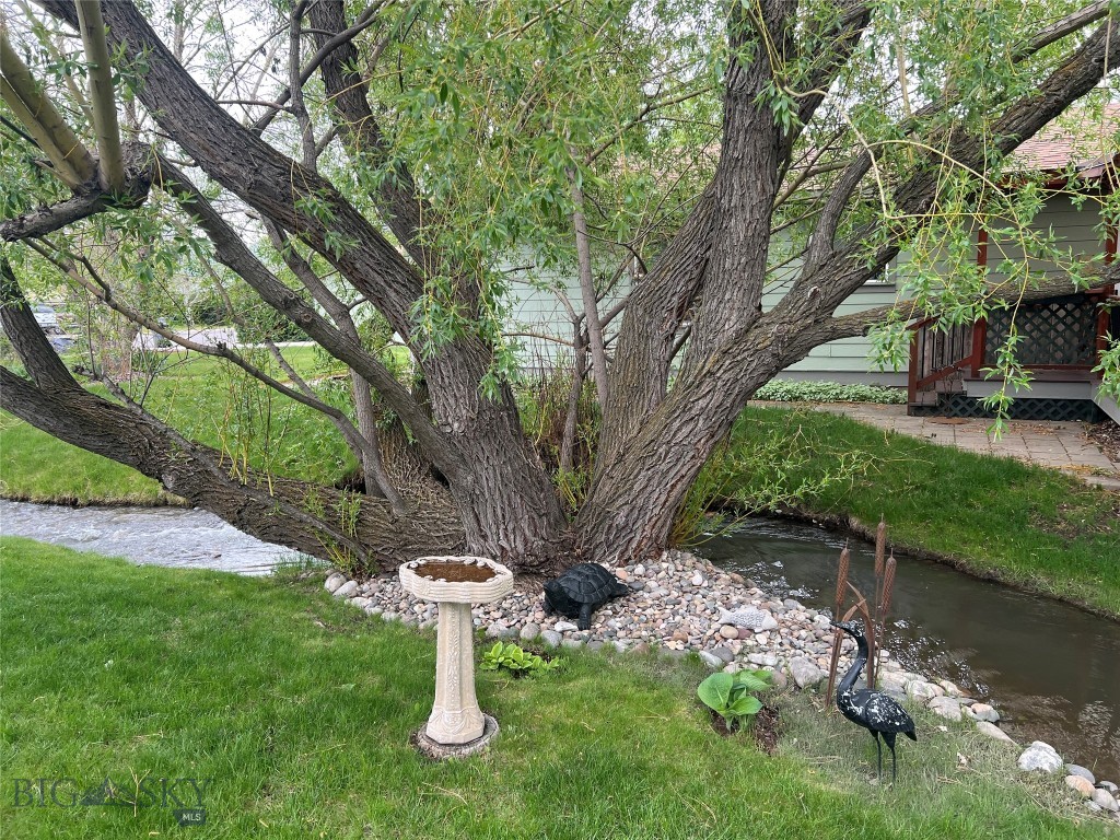 Affordable Home with Babbling Waterway & Parklike Setting!

Stop renting and start owning! 808 Golden West Drive offers the perfect blend of affordability, prime location, and a one-of-a-kind natural setting. If you've been looking for a budget-friendly home in Gallatin County that doesn't compromise on outdoor space and charm, this is it.

Highlighted by a graceful, mature willow tree, the private backyard features a tranquil, babbling seasonal ditch flowing along the property. Enjoy your morning coffee, afternoon snacks, or barbecue dinners on the deck while relaxing to the peaceful sound of streaming water. A charming footbridge leads over the water to an ideal "island" perfect for the farm-to-table gardener, boosted by abundant raspberry bushes and fruit trees on this oversized 9,250-square-foot lot.

Inside, the single-level home offers a spacious, split-bedroom floor plan designed for privacy. The primary suite features a dedicated bath and an extra-large walk-in closet, thoughtfully set away from the other two bedrooms. Brand-new waterproof laminate flooring spans the kitchen, dining area, and hallway bath, paired with new, high-quality carpeting throughout the rest of the home. Plus, with a 480-square-foot 2-car garage and a generous driveway, you’ll have plenty of room for all your vehicles, toys, and hobby gear!

As the currently lowest-priced single-family home in the valley, this property is priced to sell—offering an excellent opportunity for first-time buyers, empty nesters, or savvy investors. Enjoy a mature neighborhood setting ideally positioned in Belgrade, just a short walk or drive to local schools, parks, and downtown shops and restaurants, with an easy commute to Bozeman or the airport.

Check this out quickly—homes with water features and a park-like setting at this price point do not last long!