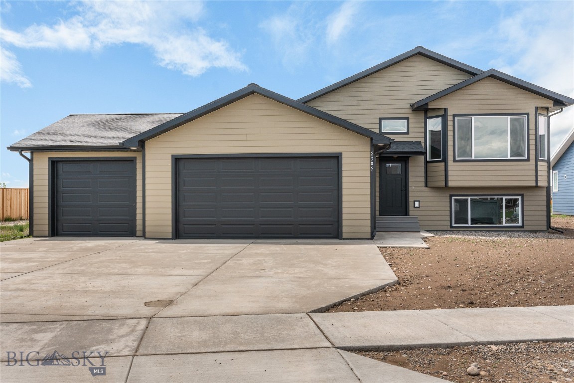 Bring your toys!! Large 3 Car Garage!! Welcome to this beautiful new construction home! An inviting entryway leads up to a spacious living room with expansive windows that fill the area with natural light. The open concept design flows seamlessly into the kitchen, complete with abundant storage, a large corner pantry and direct access to the dining area. Open the big sliding door and step out onto the deck - ideal for entertaining or enjoying quiet
evenings. The upper level includes a private primary suite with an attached bath and generous walk in closet. An additional bedroom and full bath complete this level. The lower level of this home features a large family room, 2 additional bedrooms and full bath all with daylight windows! This home is a must see!