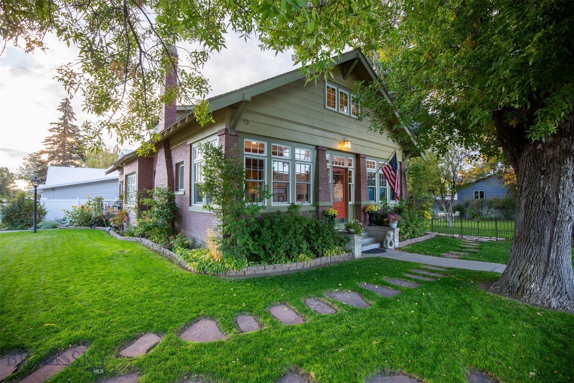 RARE OPPORTUNITY TO OWN A CHARMING HISTORIC HOME!

Beautifully updated 3 bedroom, 2 bathroom historic bungalow perfectly situated on a corner lot in the heart of Whitehall, just steps away from shops, dining, and every day amenities.  This home blends timeless character with thoughtful updates, featuring all new, top of the line, Anderson windows, fresh interior and exterior paint, original hardwood floors, classic built-ins and beautifully polished brass fixtures.  Original brick accents throughout, including a brick gas fireplace with blower, to enjoy those cool Montana evenings.

The attic has been beautifully transformed into a private 3rd bedroom, complete with a full bathroom and a second laundry area, offering excellent flexibility and privacy.  Sun-filled interior and the sun porch provide abundant natural light and a great area to enjoy the sun.  This home provides ample storage around every corner.  The unfinished basement offers generous space to customize your needs.

Outside enjoy a lush yard with mature trees, including multiple fruit trees and flowers!  Yard is landscaped with fencing and underground sprinklers.  In addition there is a shed for tools and storage!!

This is a rare opportunity to own a character-filled home with modern comforts in an unbeatable walkable location.