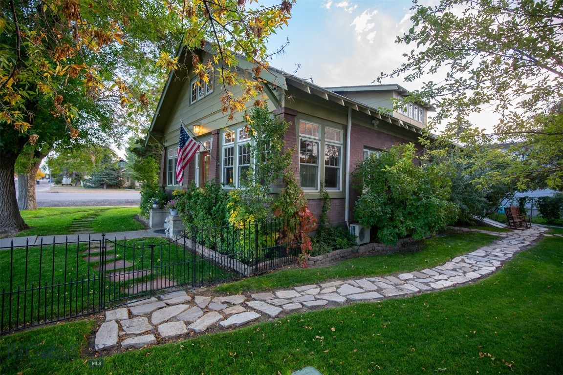 RARE OPPORTUNITY TO OWN A CHARMING HISTORIC HOME!

Beautifully updated 3 bedroom, 2 bathroom historic bungalow perfectly situated on a corner lot in the heart of Whitehall, just steps away from shops, dining, and every day amenities.  This home blends timeless character with thoughtful updates, featuring all new, top of the line, Anderson windows, fresh interior and exterior paint, original hardwood floors, classic built-ins and beautifully polished brass fixtures.  Original brick accents throughout, including a brick gas fireplace with blower, to enjoy those cool Montana evenings.

The attic has been beautifully transformed into a private 3rd bedroom, complete with a full bathroom and a second laundry area, offering excellent flexibility and privacy.  Sun-filled interior and the sun porch provide abundant natural light and a great area to enjoy the sun.  This home provides ample storage around every corner.  The unfinished basement offers generous space to customize your needs.

Outside enjoy a lush yard with mature trees, including multiple fruit trees and flowers!  Yard is landscaped with fencing and underground sprinklers.  In addition there is a shed for tools and storage!!

This is a rare opportunity to own a character-filled home with modern comforts in an unbeatable walkable location.