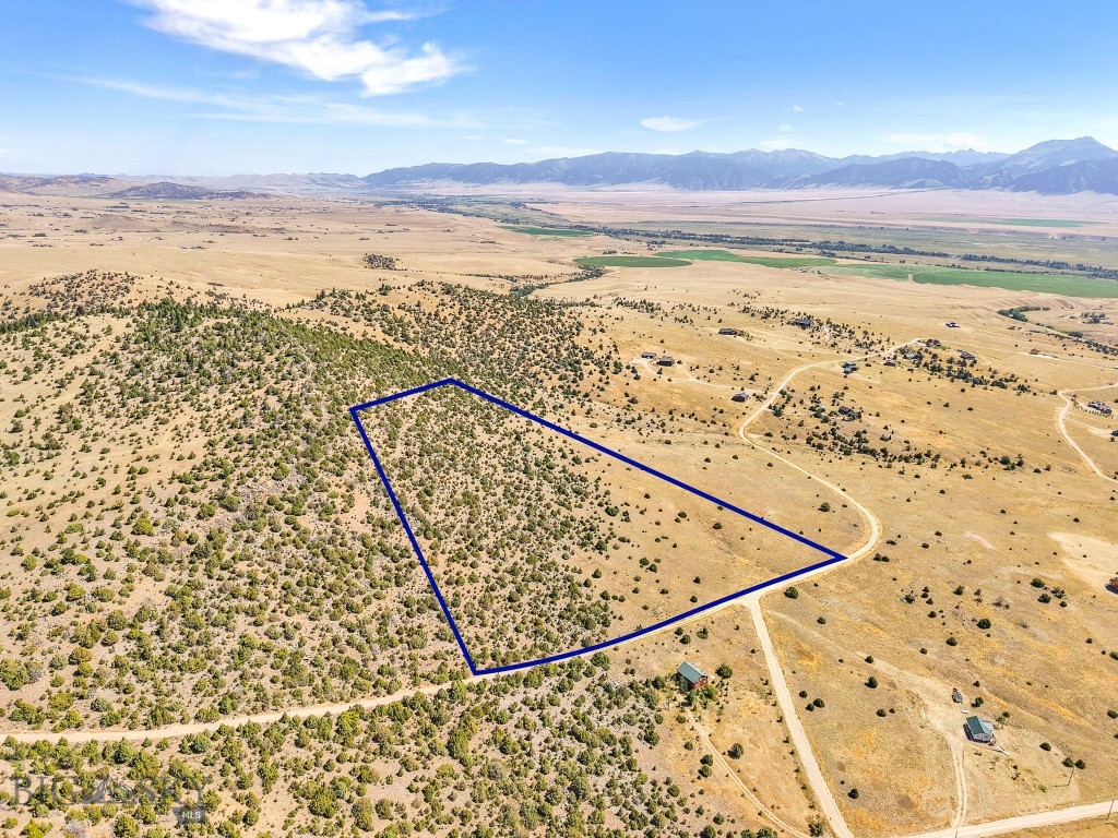 Take in the sweeping views of the Madison Range and Madison Valley from this stunning 15.5+/- acre hillside property. An ideal site for your dream home or cabin retreat, the upper portion of the parcel features dramatic rocky outcroppings and mature trees, adding character and privacy. Owners in good standing enjoy exclusive access to the trout-stocked Haypress Lakes. With Axolotl Lakes, Varney Bridge Fishing Access, and miles of public land just minutes away, the recreational opportunities are endless—hiking, fishing, hunting, ATVing, and wildlife watching are right out your back door. Conveniently located just a short drive from Ennis for shopping, medical care, dining, and other services.