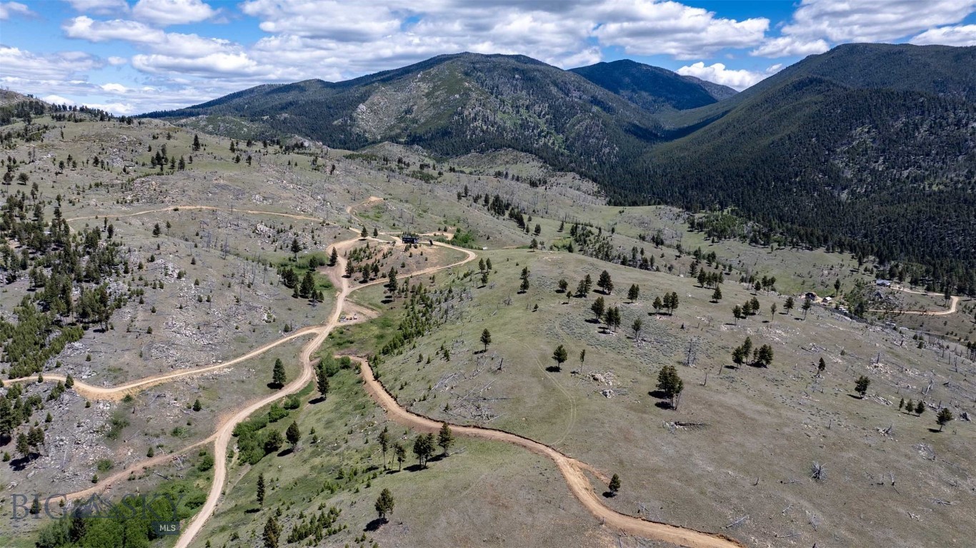 Tucked into the hills of Boulder, this beautiful 20-acre Montana property offers space, scenery, and a peaceful setting just a short distance from the National Forest. Rolling meadows, natural hillsides, scattered boulders, and sweeping views in every direction create a landscape that feels both rugged and inviting. Located in Hunting District 380, known for its special draw bull tag, the property enjoys abundant wildlife activity throughout the year. Mule deer, whitetail deer, and elk are frequent visitors, adding to the authentic Montana experience and recreational appeal. Whether you're envisioning a future homesite, a recreational retreat, or simply a place to enjoy the beauty and privacy of Montana, this parcel provides the flexibility to bring your vision to life. The combination of open meadow, rolling terrain, and unique rock outcroppings gives the land character and versatility, while nearby National Forest access opens the door to endless outdoor adventure. For those seeking even more room to roam, the neighboring 20-acre parcel is also available for purchase (MLS30073162), creating a rare opportunity to own a combined 40 acres of Montana land. Whether purchased individually or together, these properties offer privacy, views, wildlife, and a true connection to the outdoors.