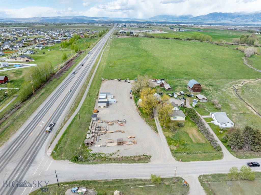 This unzoned, covenant-free 3±acre commercial property offers 500± sq ft of high-visibility frontage on Jackrabbit Lane, located midway between Belgrade and Four Corners in one of Montana’s fastest-growing corridors. With convenient access to I-90, Bozeman, and Big Sky, this lot includes ample gravel parking, a large shop, and a practical two-story farmhouse—ideal for flexible live/work use. Enjoy a steady revenue stream with the current leases generating approximately $9,400/month in combined rental income. Don’t miss this prime opportunity to capitalize on the commercial/residential expansion transforming the Jackrabbit Lane corridor.

*Billboard permit and easement application for NW corner of the property currently pending with MDT. Permit rights do not convey at current list price but are negotiable upon permit approval.