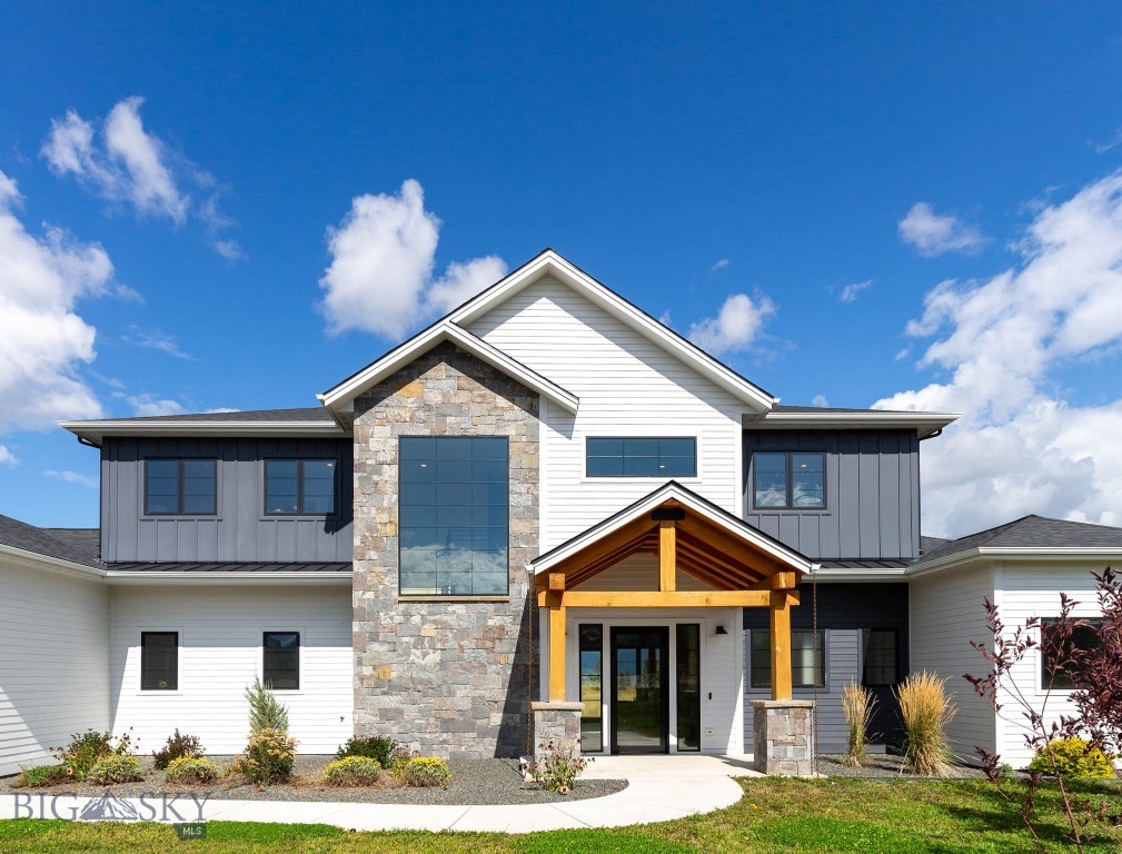 Welcome to this exceptional estate in the prestigious Home 40 Subdivision—Bozeman’s premier south side community, known for its sweeping mountain views, expansive open space, and unparalleled amenities. Situated on just over an acre, this 4,487 sq ft custom home offers timeless design, luxurious finishes, and functional elegance throughout. Step inside to an open-concept floor plan that perfectly blends modern comfort with refined style. The heart of the home is a gourmet kitchen featuring top-of-the-line Thermador appliances, a custom island, walk-in pantry, and a stylish bar area—perfect for entertaining. Gather around the floor-to-ceiling fireplace in the great room, or open the doors to the covered patio and take in the unobstructed Bridger Mountain views. The main-floor primary suite is a private retreat, complete with a spa-inspired bathroom, expansive walk-in closet, and its own dedicated patio where you can enjoy your morning coffee or evening sunsets. A separate main-floor guest bedroom and ¾ bathroom offer comfort and privacy, ideally located near a dedicated office with picturesque mountain views. Upstairs, discover two versatile loft spaces, three spacious bedrooms—one with a private ensuite—and an additional full bathroom, offering flexible living and hosting options. Additional features include a heated 3-car garage with abundant storage, central A/C, a fire suppression system, whole-house water softener, and a state-of-the-art security system. Enjoy luxury living year-round with access to Home 40’s exclusive community amenities: a fully equipped fitness center, outdoor pool, scenic trails, tranquil pond, and over 40 acres of preserved open space. Nestled in the heart of the Gallatin Valley, this exquisite residence offers easy access to Hyalite Reservoir, Montana State University, downtown Bozeman, and world-class skiing at Big Sky and Bridger Bowl. Don’t miss this rare opportunity to own a remarkable home in one of Bozeman’s most sought-after neighborhoods—where luxury, lifestyle, and location converge.