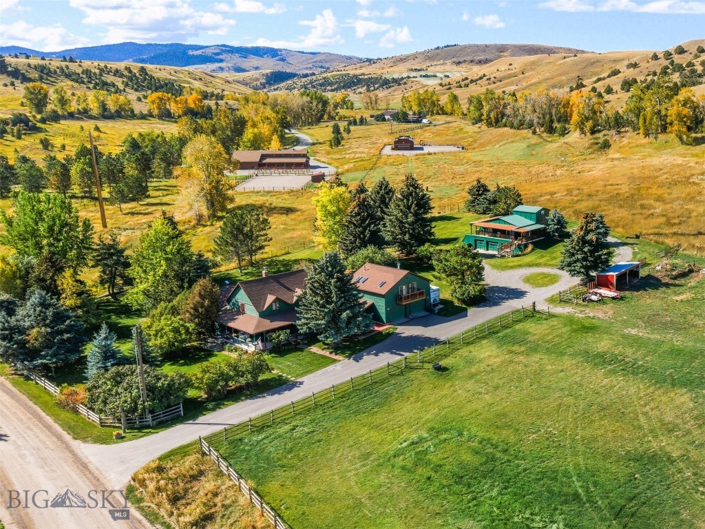 Location, Location, Location! Fabulous, 3B|2B completely renovated  MAIN HOME and 2B|1B DETACHED GUEST HOUSE with 2-Car Garage on 4.3 acres close to the Gallatin River for fly fishing and floating, Big Sky for hiking and adventure and charming Downtown Bozeman for shopping and dining. There's  NO ZONING, NO COVENANTS, and a YEAR ROUND CREEK meandering through the yard. This is a perfect place for you to spread out, have animals, and enjoy life. Host weddings, concerts, whatever your heart’s desire. TURN-KEY, FULLY FURNISHED AND READY TO GO! Main house, guest apt, and guest house. Versatile property for possibly your multi-generational living? Want horses, chickens or goats? Set up for livestock with gorgeous views of the Bridger Mountains and foothills. Main Home - 3B|2B with wrap around covered porch, park-like setting, the sounds of live water, and mature trees. Guests will enjoy their own private, ATTACHED 1B|1B full GUEST APT or they can have their very own detached Guest Home with 2B|1B, covered deck, 2 car garage.  This wonderful cozy home with it's hickory wood floors, river rock, wood burning fireplace, a kitchen for entertaining and spacious bedrooms and bathrooms is sure to delight any buyer seeking freedom to do whatever they want with a property. Use it for generational living, Air BNB or live in the main house and rent the other two. There's a home for everyone to stretch out and experience peace, tranquility and a dark night sky for star gazing. Bring your horses, cattle, lamas, goats, dogs and cats and come experience one of the best locations in Gallatin Valley. Enjoy the quietness and close proximity to the areas crown jewels: The Gallatin River for blue ribbon fishing and floating only two minutes away, Bozeman, with incredible dining/shopping, Deaconess Hospital, MSU, Hunting in our National Forests just 5 min away, and Skiing the Big Sky trails only 30 minutes away. And the best part of it all, the beloved Stacey's Cowboy Bar and Steakhouse just 2min down the road. This is the place to LIVE out the Montana Dream! Property has Underground Sprinklers over 2 1/2 acres.