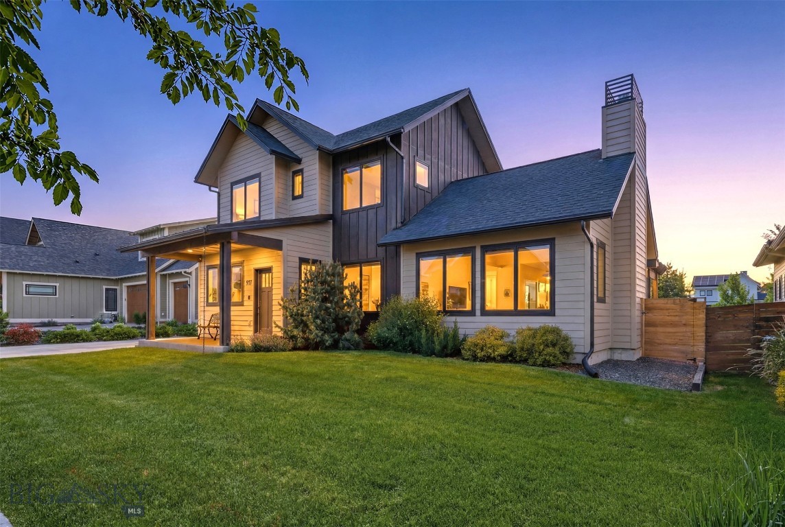 This exquisitely built, 4 bedroom, 3 bathroom masterpiece of refined living awaits you in Bozeman’s premier Flanders Mill enclave, where architectural styling pairs haute couture design with effortless functionality. This bright and cheery residence positions itself directly against a pristine open-space corridor for wonderful privacy and sweeping vistas. Inside, the epicurean kitchen serves as a centerpiece of culinary artistry, boasting state-of-the-art, Italian-engineered Bertazzoni appliances, center island, and custom walk-in pantry. Entertainment options expand effortlessly as a dramatic tri-fold glass wall glides open to a beautiful pergola-shaded patio for high-end al fresco dining and entertaining. The main-level primary retreat offers an opulent, spa-inspired sanctuary featuring a large, glass enclosed tiled shower, a deep soaking tub, and heated towel bars. Throughout the property, elite craftsmanship manifests in bespoke ironwork, designer lighting, and immaculate, turn-key finishes that define every room. You’ll also enjoy vaulted ceilings, AC, gas fireplace, an oversized two-car garage with built-in shelving and cabinetry, a security system, fenced backyard with direct access to the trails out your back gate. Ideally located in the heart of the north side, just blocks from several schools, soccer fields, shopping and dining, with quick access to Downtown Bozeman and the Airport. This is a MUST See property!