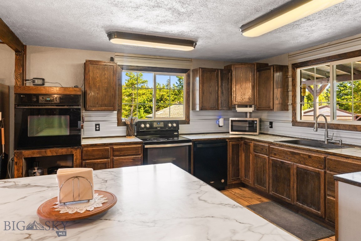 Welcome to a home where country living and outdoor adventure come together. This 4-bedroom, 2-bath sits on just over 10 acres with no HOA, giving you the freedom to live the Montana lifestyle your way. A brand-new addition makes it easy to gather friends and family—whether for holidays, celebrations, or quiet evenings by the fire.

The property is set up for goats, chickens, turkeys, and more, with fencing that secures your animals while still allowing wildlife to pass through. A seasonal creek adds to the setting, creating a peaceful backdrop right outside your door.

Adventure begins the moment you step outside. The Continental Divide Trail, Thompson Park, and Beaverhead - Deerlodge National Forest are all close by, offering endless opportunities for hunting, hiking, biking, horseback riding, and wildlife viewing. And when you need to connect with the wider world, Butte and Bert Mooney Airport is about a 15 minute drive away.

Here, mornings start with feeding animals, afternoons with a trail ride or mountain hike, and evenings watching the elk, deer and more with family gathered close. This isn’t just a home—it’s pure Montana living.