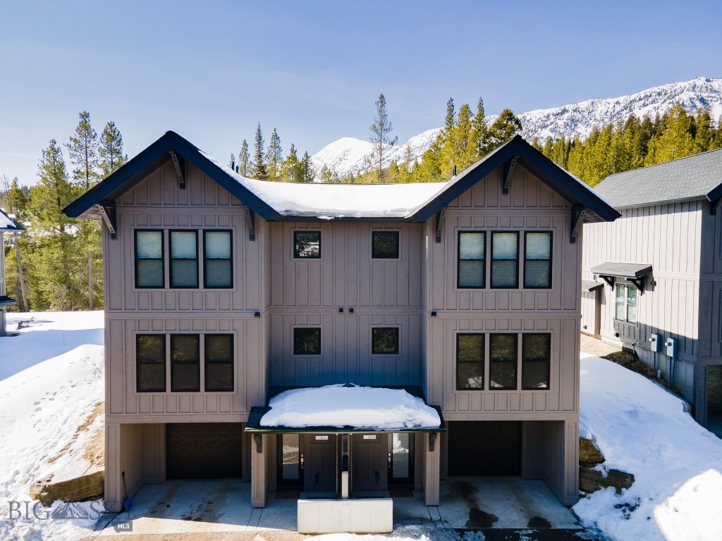 Kick back and relax in this better than new, turnkey mountain retreat in the beautiful Bridger mountains of Montana. This beautiful home is one of very few homes in the Bridger Pines community which is saddled between Bridger Bowl and the Crosscut Mountain Sports Center; less than 5 minutes to either one and just 20 minutes to Bozeman, MT. Adventure awaits you right out the front door no matter the season, enjoy downhill skiing, nordic skiing, mountain biking, hiking or just relaxation in the alpine setting and pine scented air. Inside, enjoy the comforts of well thought out design and the luxury furnishings that are sold with the condo. From the heated garage, one enters home on entry level perfect for storing the gear of your adventures. Ascending to the second floor, one finds an inviting open concept kitchen, living room and dining area with big windows to take in the alpine views as well as cozy fireplace to gather around. The living area opens up onto patio and large shared yard. There is also a half bath and laundry area. Moving up to the third floor , there is a primary bedroom with walk in closet and en suite bathroom with dual sinks, glass in shower all finished with designer tile and fixtures. There is also a second bedroom with sitting area and full bathroom which is accessed from hallway outside bedroom. When not personally able to enjoy all of this splendor, this home can be short term (vacation) rented through a special zoning designation that allows vacation rentals though it is in an area that is otherwise highly restrictive. Please reach out to agent regarding more information on rental history.  Both units A and B which comprise the entire building, can be purchased together.  Please inquire.