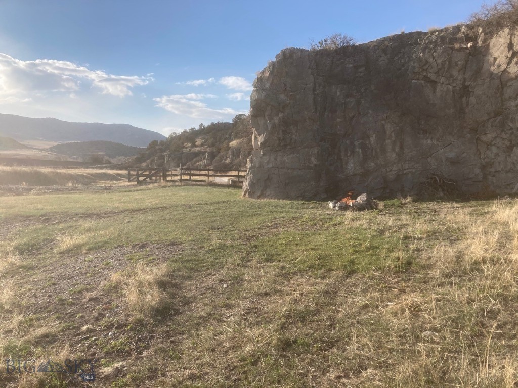 Wide-open views, rolling terrain, and endless outdoor access define this 22± acre parcel in Ponderosa Pines, located less than one mile from paved Clarkston Road. The property features approximately five acres of level ground well-suited for building, paired with 17 acres of bluffs and gently rolling hills that create a dynamic landscape and natural separation.

To the west across the railroad easement, are approximately 494 acres of public land managed by Montana Fish, Wildlife & Parks, offering close proximity to the Missouri River corridor along with established walking and biking trails. An additional 400± acres of State land borders the north end of the property, enhancing the open feel and providing nearby opportunities for recreation and exploration.

Access is provided via an easement across the seller’s adjacent parcel to the south. Electricity is available at the lot line, and a septic drain field site has been identified.

Whether you’re planning a full-time residence, seasonal escape, or recreational basecamp, this Ponderosa Pines property offers space to roam, room to build, and immediate access to some of Montana’s most sought-after outdoor amenities.