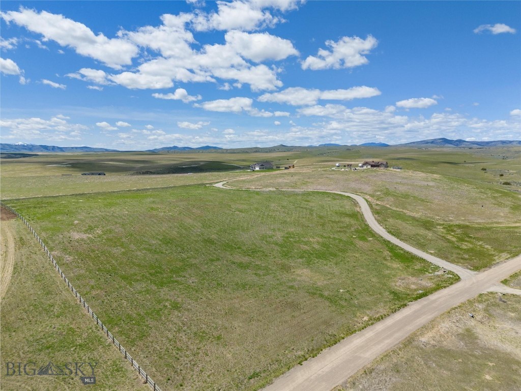 Priced Below Assessed Value!

Discover a rare 6.36-acre sanctuary in the exclusive Rolling Glen Ranch community, perfectly positioned on the edge of Three Forks, Montana. This isn’t just land; it’s your invitation to live in the Montana dream.
With panoramic mountain vistas stretching across your horizon, your custom home basks in the peace and privacy of a premium end-of-development location.

This expansive lot offers the freedom to build multiple structures, including a shop or studio tailored to your creative or mechanical pursuits. And the essentials? They’re already in place. Power is conveniently available at the lot line, and a shared driveway is ready to welcome you home, saving you time, money, and effort.

This is more than a piece of land; it’s a canvas for your Montana masterpiece. Seize the opportunity to craft a lifestyle with wide-open skies, natural beauty, and limitless potential.

Formerly known as 13 Morning Glory — but soon to be known as home.