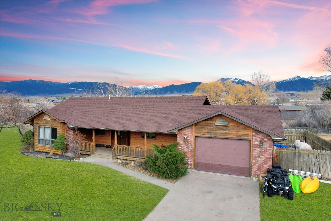 Moores Creek and Madison Mountain Views make this 2 bedroom - 2 bath home unique among the competitors inside the Ennis City limits.  Covered front porch entry leads you into an open floor plan with Living Room, Kitchen, and Dining area as the center and heart of the home.  There is a wet bar in the living room and the brick wall is plumbed for a propane fireplace-stove.  Two bedrooms, one full & one 3/4 baths, and an attached single car garage complete the package.  The .75 acre lot is landscaped and is conveniently located minutes from downtown Ennis, Ennis Schools, and the Ennis post office.  The adjoining bare land parcel to the north is also listed at $169,000 so you can purchase it along with the house and use it for future expansion, another home, or just keep it for elbow room (check to make sure it is still available).  There are light covenants which help protect your values.  Priced appropriately for your first home, your retirement home, rental investment or whatever fits your next chapter.  Want more elbow room - consider adding that adjoining Lot 1A of BHE - listing #409710.