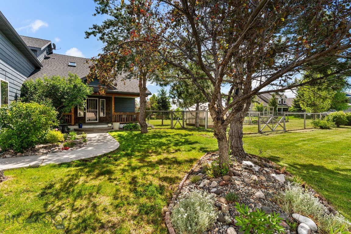 Greenhouse. Established edible gardens. RV parking. Nearly half an acre. 5 bedrooms. 3.5 baths. This Four Dot Meadows property offers the space, flexibility, and Montana lifestyle today's buyers are looking for.

Rarely does a property offer this much space, flexibility, and outdoor abundance in one of Belgrade's most sought-after neighborhoods. Welcome to 194 Four Dot, a beautifully maintained 5-bedroom, 3.5-bath home situated on a landscaped 0.485-acre corner lot in Four Dot Meadows.

Offering nearly 2,900 square feet of living space, this thoughtfully designed home features vaulted ceilings, radiant in-floor heat, and an open-concept floor plan that seamlessly connects the living, dining, and kitchen areas. The main-floor primary suite provides a private retreat with a walk-in closet, jetted soaking tub, and separate shower. An additional main-level bedroom offers flexibility as a guest room, home office, or hobby space.

Upstairs, you'll find three additional bedrooms, two full bathrooms, and an expansive bonus living area complete with a wet bar and mini refrigerator. Whether used as a media room, game room, guest retreat, or multi-generational living space, this versatile area offers endless possibilities.

Outside is where this property truly shines. The oversized corner lot features mature landscaping, underground sprinklers, a fenced backyard, and ample room for RV, camper, boat, or recreational vehicle parking. Gardeners and outdoor enthusiasts will appreciate the greenhouse and established edible landscape featuring honeyberries, raspberries, blueberries, strawberries, currants, rhubarb, asparagus, chives, sage, thyme, catmint, lovage, garlic, shallots, and Walla Walla onions. Mature Honeycrisp apple, sweet apple, and apricot trees provide seasonal harvests, while tulips and crocus add beautiful color throughout the seasons.

Designed for entertaining, gardening, and enjoying Montana's outdoor lifestyle, this property offers a rare combination of comfort, functionality, and self-sufficiency. Residents of Four Dot Meadows enjoy neighborhood parks, walking trails, and convenient access to schools, shopping, dining, and everyday amenities, all just minutes from Bozeman and the endless recreation opportunities of the Gallatin Valley.

If you've been searching for a home with room to grow, space to gather, and a backyard that produces as beautifully as it blooms, 194 Four Dot is a must-see.