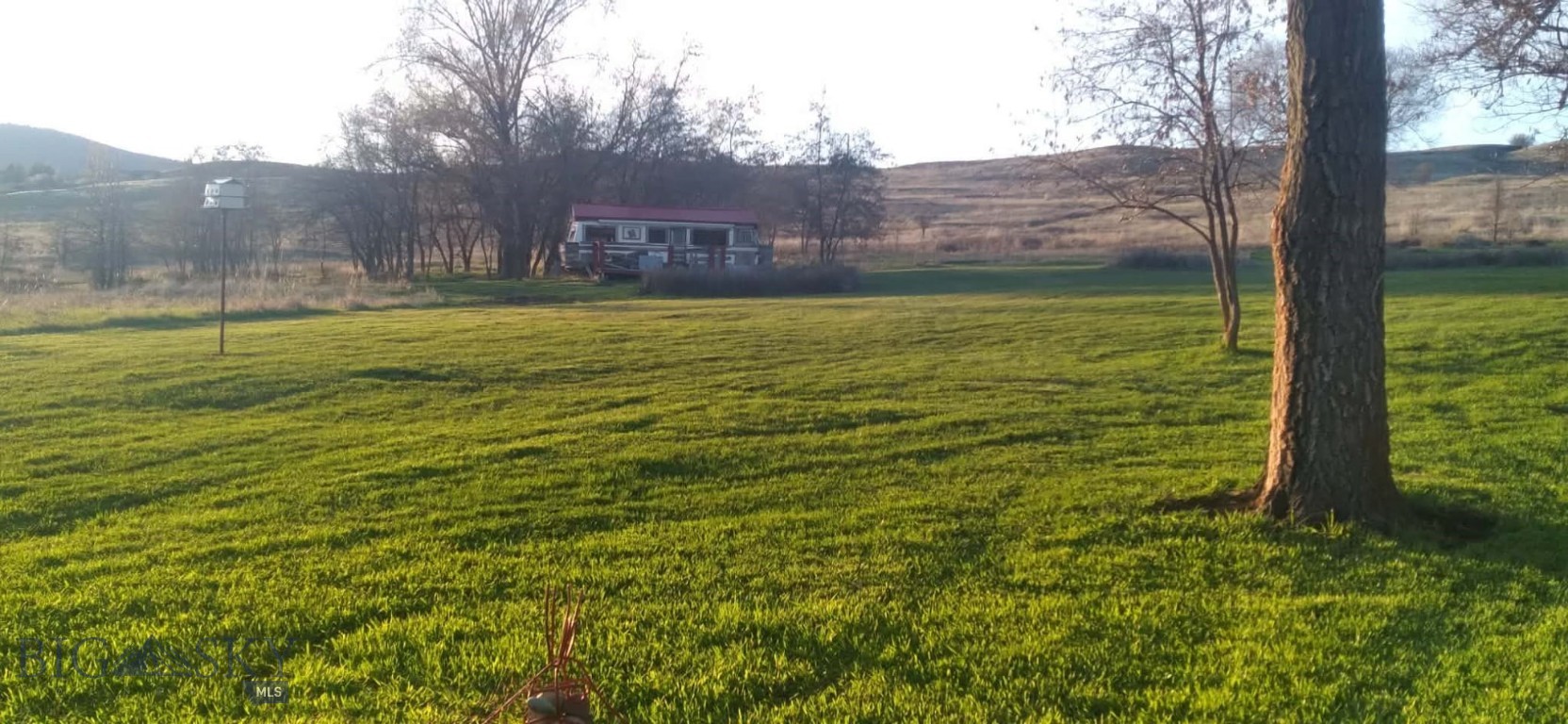 Never before on the market!  This beautiful piece of property has so much potential to add to what is already on site!  Create on off-grid homestead or retreat for family and friends.  This 9.56 Acre parcel hosts a small cabin, and two converted motorhomes that can be used for glamping or air bnb.   The views are amazing and the proximity to the lake, Glacier Park and more !