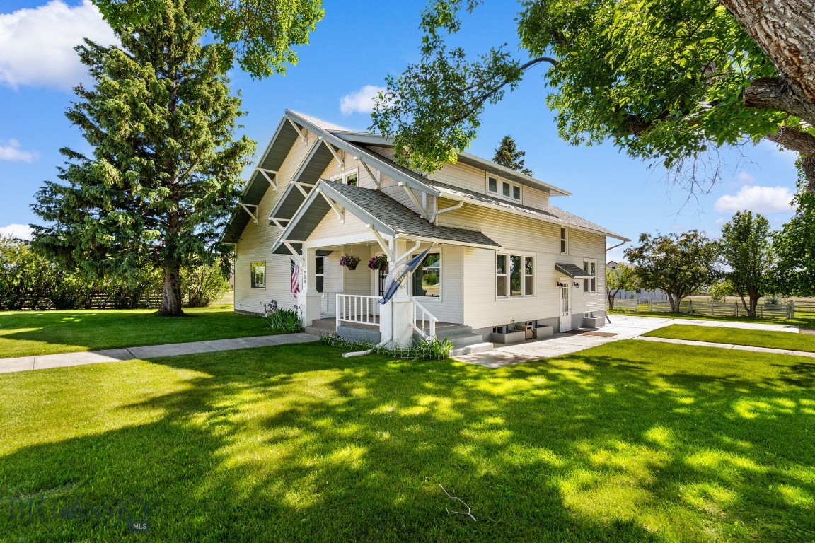 This charming early-1900s home in Sheridan MT blends historic character with modern upgrades—perfect for comfortable living in the scenic Ruby Valley. This home has been meticulously and lovingly maintained with exceptional care and attention to detail. Step inside a timeless formal front room and dining area with built-in shelves, plus a cozy sitting room that adds vintage ambiance. The open kitchen flows seamlessly into a spacious great room, ideal for gatherings, with a main-level spare bedroom and full bath for easy accessibility. Upstairs, the large primary bedroom features a sitting area and cedar-lined walk-in closets, accompanied by two additional bedrooms and two full baths. The finished basement offers a game room with display shelves, a workout/flex space, and a generous laundry room with built-in storage. Enjoy ultra-low utilities thanks to a complete solar power system that often generates surplus electricity—resulting in an average $4/month electric bill! Upgrades include modern wiring, plumbing, steel siding, and roof. Dual electric water heaters ensure plenty of hot water. The 1.2 acre property (two lots) provides tranquility with mature trees, fruit trees, young pines, with a buffer lot. Underground sprinklers fed by a private well keep the lush landscaping vibrant, while newer gutters and leaf filters protect the home. Outdoor perks include fenced dog runs and an updated 1918 barn/shed with power, insulation, indoor kennels, and outdoor access. There is an additional powered shed perfect for a workshop. There's RV parking with a 50-amp hookup, an attached one-car garage, circular driveway, and newer hot tub. Nestled in a quaint town in SW Montana, this home offers easy access to outdoor adventures, history, and spectacular mountain views - making it perfect for a full-time residence, second home, rental, Bed & Breakfast, and more! Schedule a showing today to experience this rare gem!