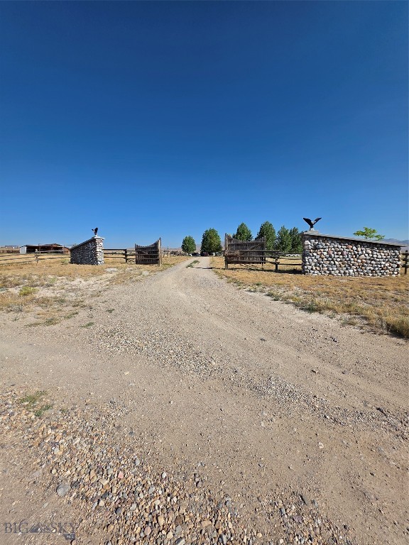SELLERS TO CREDIT BUYERS $20,000 TOWARDS BUYERS CLOSING COSTS, ORIGINATION CHARGES, DISCOUNT POINTS, RATE BUY DOWNS, AND/OR PRE-PAIDS ALLOWED BY THE LENDER financing for this property.. A great start when Buyers need financing. This 40 acres close to Twin Bridges has awesome views surrounding the area which is set up for horses, cattle or any animal of your choosing.  The barn has 2 stalls, feeders, power, a tack room with an awesome inside out-house and  compose toilet. There is a round pen, horse pens, corrals, metal gates, and electric fencing to keep animals from wandering. Pereminter fencing around the land and house, all with a grand entrance at 38 Sundust Lane . Memories are possible with this property.  An entry  porch is handy for  hanging coats, droping boots before entering this cozy home .  Welcome to 38 Sundust Lane! Amazing  river rock fireplaces , one in the front room adorning this space with warmth and a second river rock fireplace in the master bedroom.  No need to worry about being cozy. The Living room has ample space with the dining area and a roomy kitchen.The laundry room houses a pantry for extra food and storage. Views in all directions from this home, with  views from a deck outside the master bedroom.  This area, land and home is ready for a new owner.  Call for an appointment.