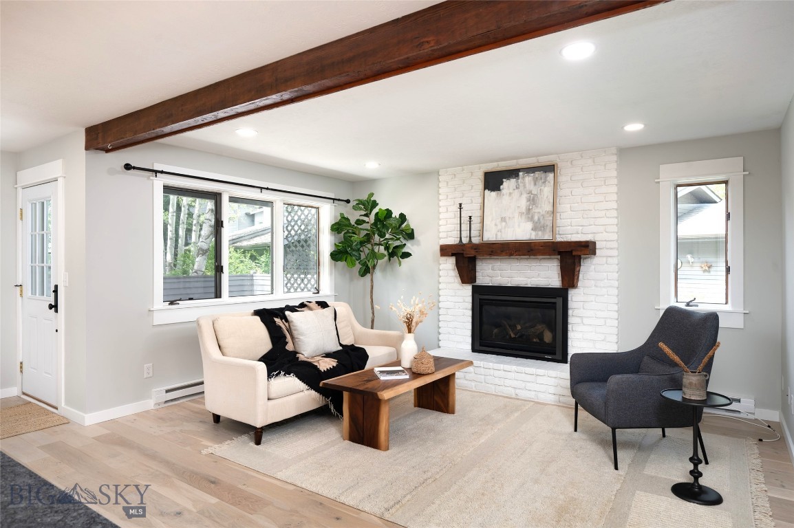 VERY Stylish, 2B|2 Full Baths, single level, completely opened up and remodeled Bozeman pied-a-terre in sought after SOUTHBROOK CONDOS! You'll love this quiet neighborhood filled with mature trees, songbirds, and longtime resident owners. Impeccably remodeled, walls removed and living/kitchen/dining space opened up for a nice flow and updated look. With all new flooring, new interior paint, lots of new can and designer lighting, new granite countertops, cabinet hardware and SS appliances, this place feels like new! Ground level with rear patio backing to green space under large mature trees and professional landscaping. Modern, bright & airy floor plan w/ great flow emphasized by new, White Oak wood flooring throughout and wool carpeting in the bedrooms. Living room is anchored by the brick gas fireplace, hearth & 2 walls of windows. Spacious kitchen has new granite counter tops, freshly painted cabinetry, new hardware & newer Kitchen Aid appliances and walk-in pantry. With a huge, center island & bar-top seating, you can entertain to your heart's content! Cozy dining area also has space for a desk and home office set-up or additional kitchen storage. Extra large, extended covered patio is tucked into a private corner of the open space and feels like your own little oasis. Primary Suite with wool carpeting, window seat and wall of closet's makes for a relaxing retreat. Having company or roommates is easy with 2nd guest bedroom and 2nd full guest bathroom. Newer stacked washer & dryer closet with additional storage for vacuum cleaner, mop, etc... 1-car garage with auto door & attic storage with pull down ladder makes storing the "extra's" possible. Arguably the best location within the complex. Condo sits across from extra parking, mailboxes & main entrance. Recently paved interior roads, curbs, gutters. Fantastic location fits all your needs: near shopping center with grocery, coffee shops, dining & retail. Blocks to MSU campus, Fieldhouse & Bobcat Stadium. Public bus system at the corner will take you Downtown & all over the valley, even connecting to shuttles up to Bridger Bowl or Big Sky. Great lock-and-leave condo with HOA covering water/sewer, snow removal to your front door, exterior maintenance & insurance, landscaping. Perfect spot for anyone interested in getting a foothold in the Bozeman real estate market. Extremely well built and insulated by high quality builder, Ken LeClair! Broker Owned.