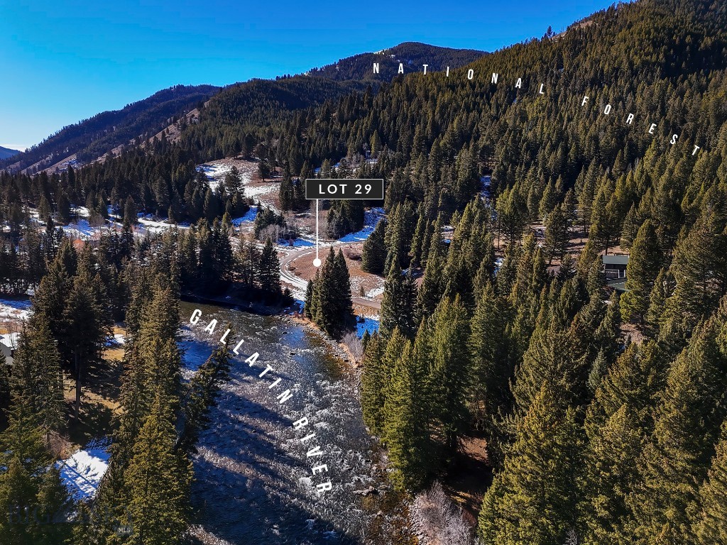 Calling all outdoor adventurers—this is Montana living at its finest!  Imagine your dream home on a rare vacant parcel with unencumbered views and unobstructed access to the iconic Gallatin River.  Just 100 yards away, thousands of acres of Custer Gallatin National Forest await—your backyard playground for hiking, biking, backcountry exploring, and endless fresh-air therapy.

Perfectly positioned in the sweet spot of the canyon, you’re less than ten minutes to the world-class amenities and slopes of Big Sky and approximately thirty minutes to the vibrant dining, culture, and charm of Bozeman. Adventure is always within reach—whether it’s a day trip to Yellowstone National Park just an hour south, or seamless air travel via Bozeman Yellowstone International Airport forty-five minutes north.

The gentle rise of the land creates an inspired homesite opportunity—elevated just enough to capture sweeping mountain views up and down the canyon while overlooking a charming seasonal stream below.  Picture expansive windows, a thoughtfully designed deck, morning coffee with river mist rising in the distance, and evenings painted in alpenglow.

Cast a line.  Lace up your boots.  Breathe deep.  This is your slice of Montana heaven—where river days, forest trails, and mountain sunsets become part of your everyday story. Time to make your story happen today!!